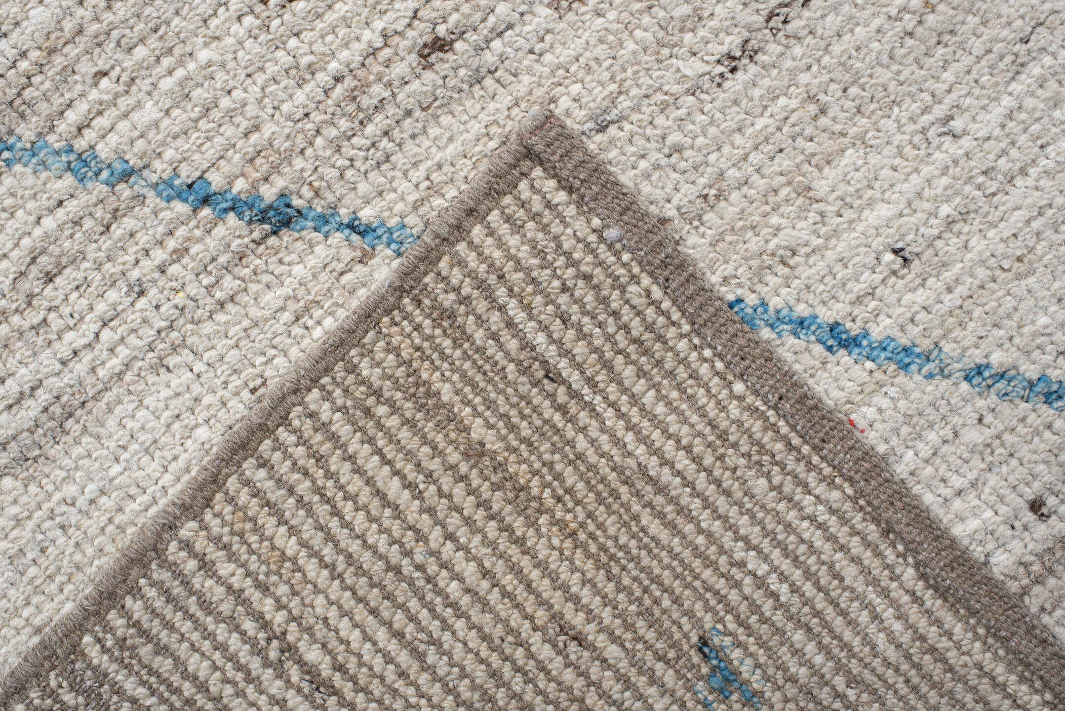 11' x 9' one-of-a-kind handmade vintage Tulu rug. Color palette: ivory, sky_blue, taupe, peach, blush, muted_gold, brown