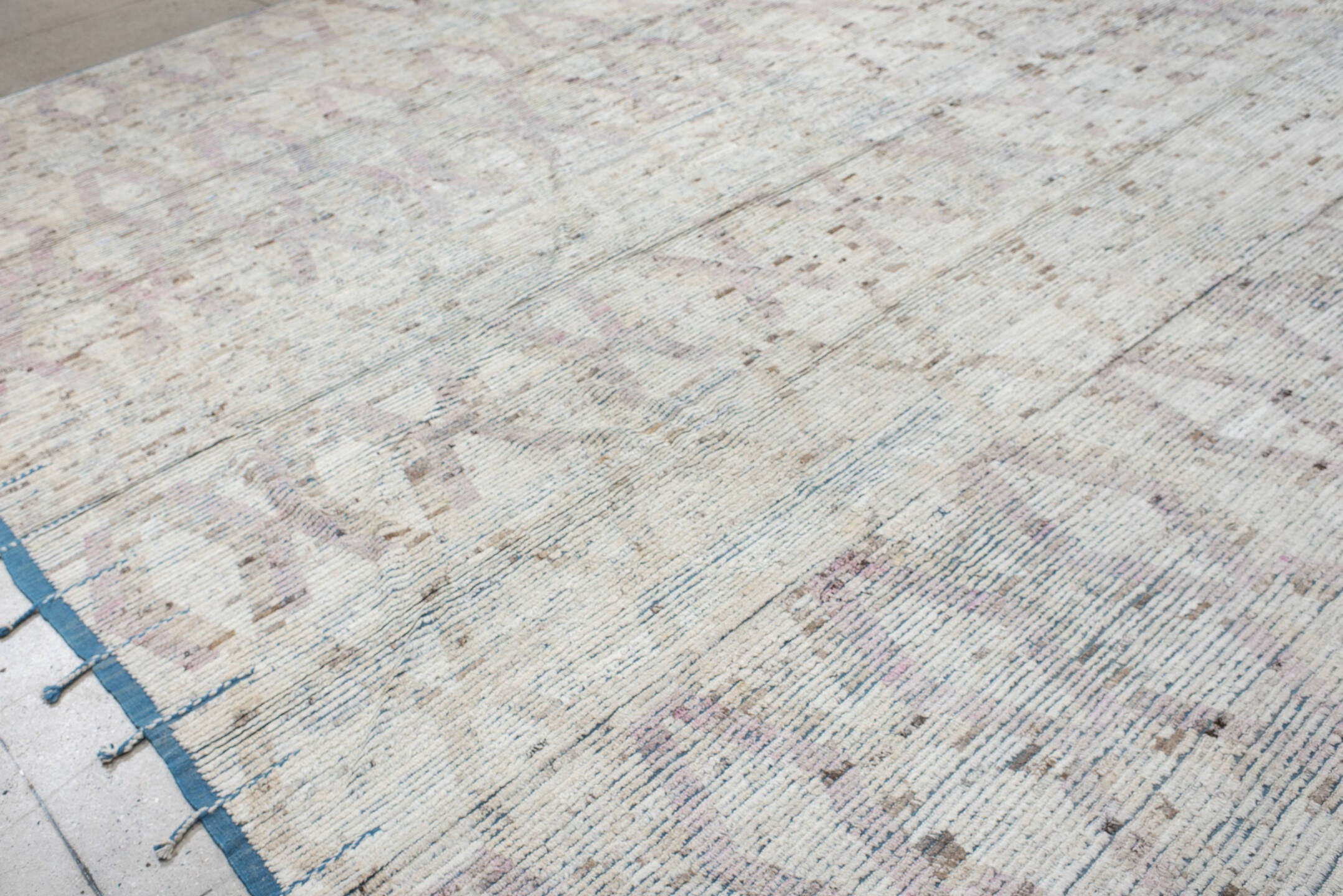 14' x 15' one-of-a-kind handmade vintage Tulu oversize rug. Color palette: ivory, pale blue, blush, taupe, beige, brown