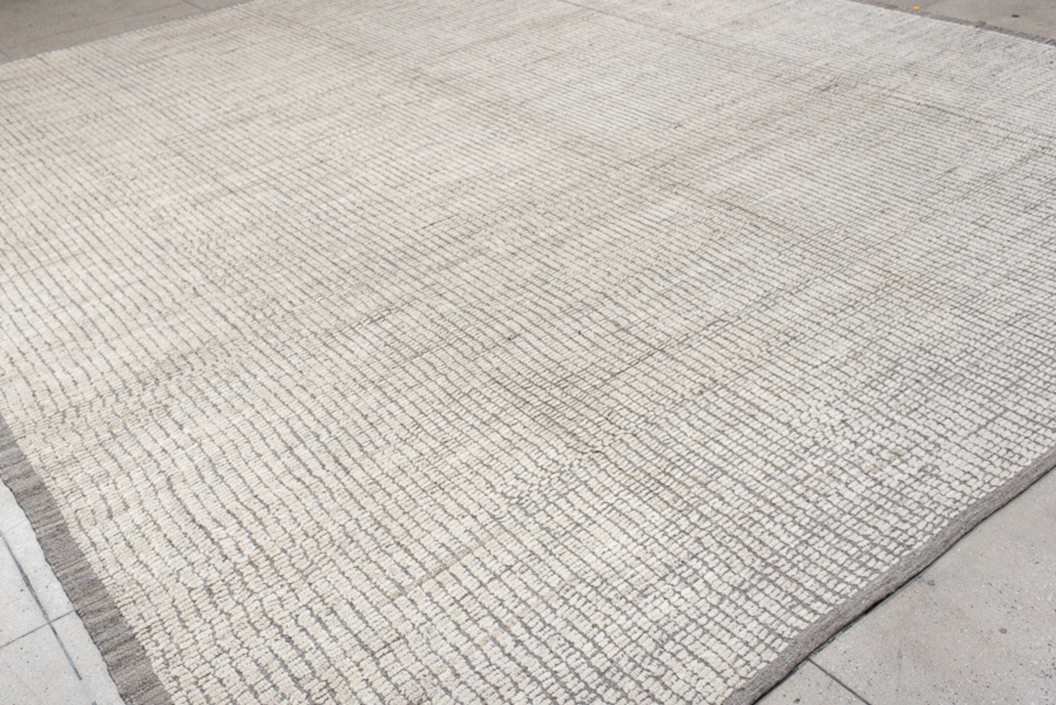 12' x 14' one-of-a-kind handmade vintage Tulu oversize rug. Color palette: ivory, taupe, gray, cream, beige