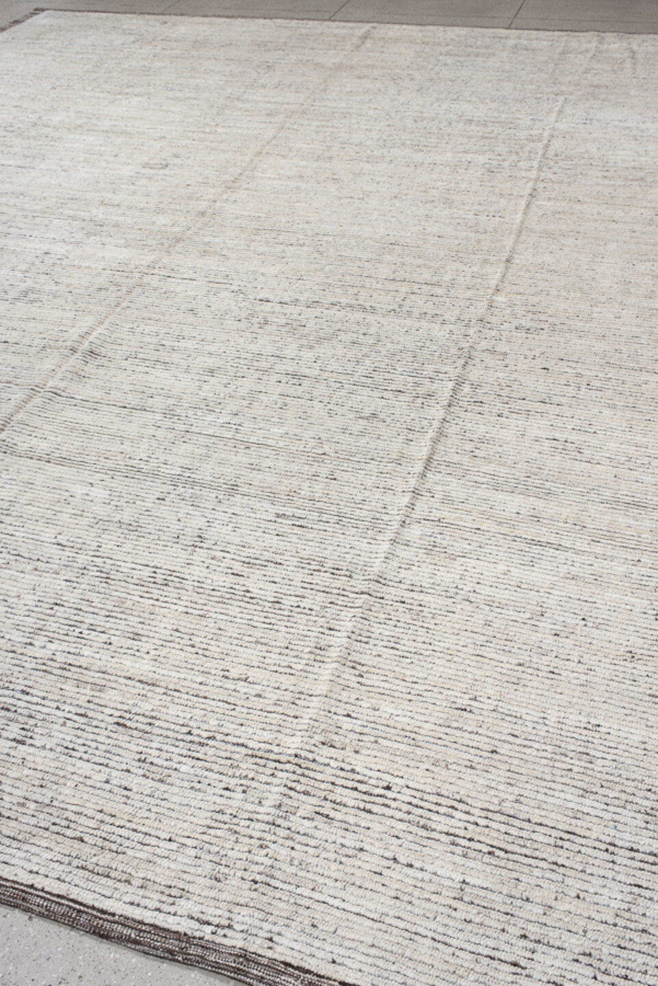 12' x 14' one-of-a-kind handmade vintage Tulu oversize rug. Color palette: ivory, charcoal, taupe, cream, gray, black, beige