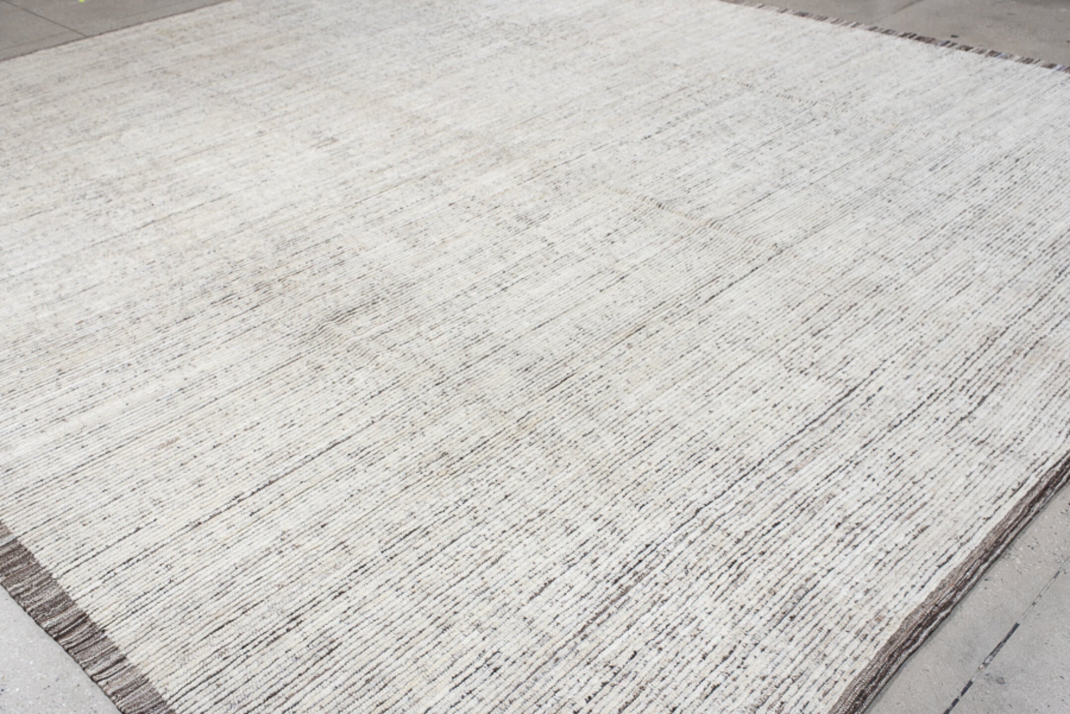 12' x 14' one-of-a-kind handmade vintage Tulu oversize rug. Color palette: ivory, charcoal, taupe, cream, gray, black, beige