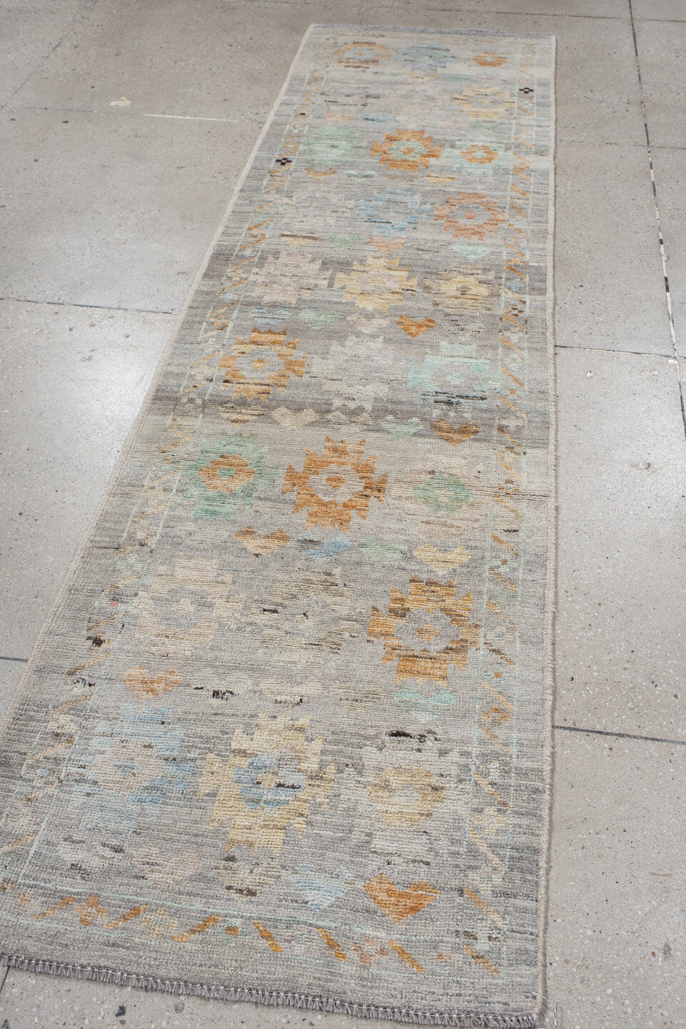 2' x 10' one-of-a-kind handmade vintage Tulu runner rug. Color palette: gray, ivory, aqua, apricot, taupe, charcoal, sand