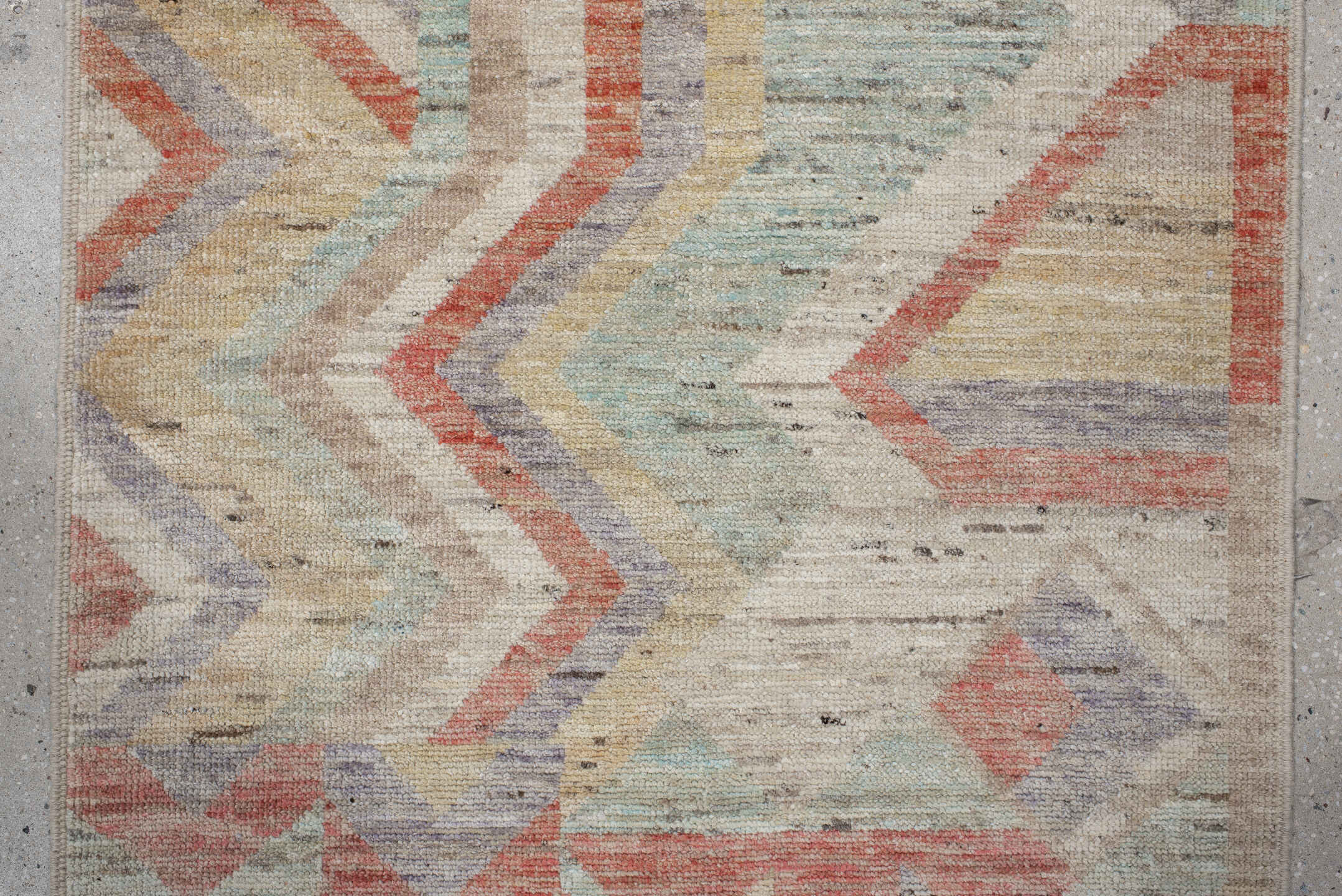 3' x 9' one-of-a-kind handmade vintage Tulu runner rug. Color palette: light gray, gray, off-white, pink, brown, orange