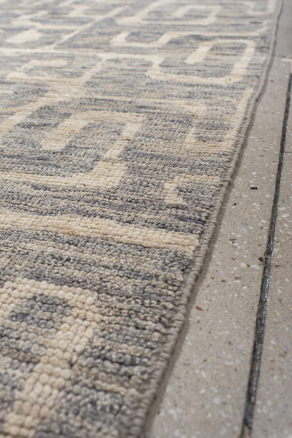 4' x 9' one-of-a-kind handmade vintage Tulu runner rug. Color palette: ivory, gray, slate, cream