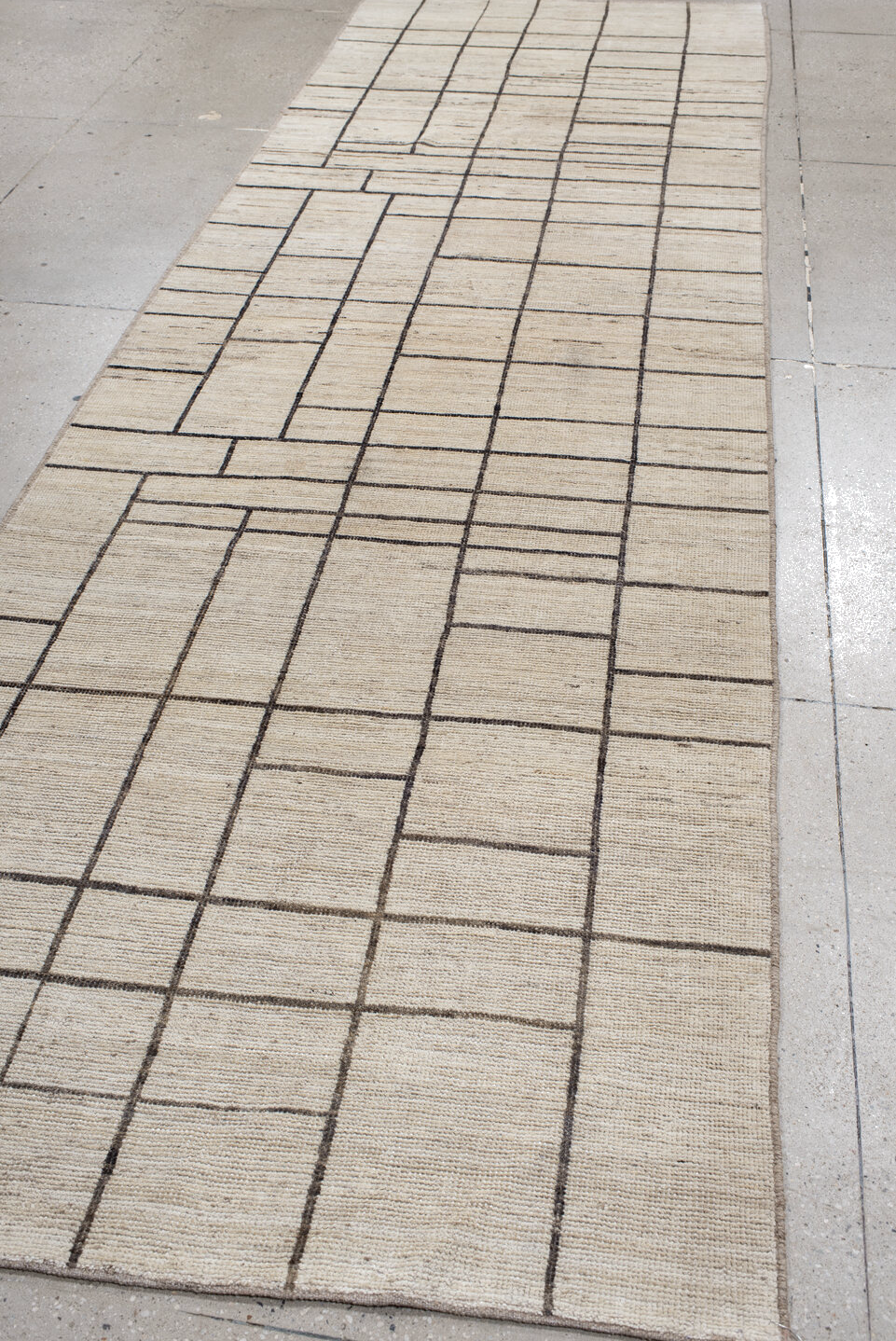 4' x 13' one-of-a-kind handmade vintage Tulu runner rug. Color palette: black, brown, gray, light gray, off-white