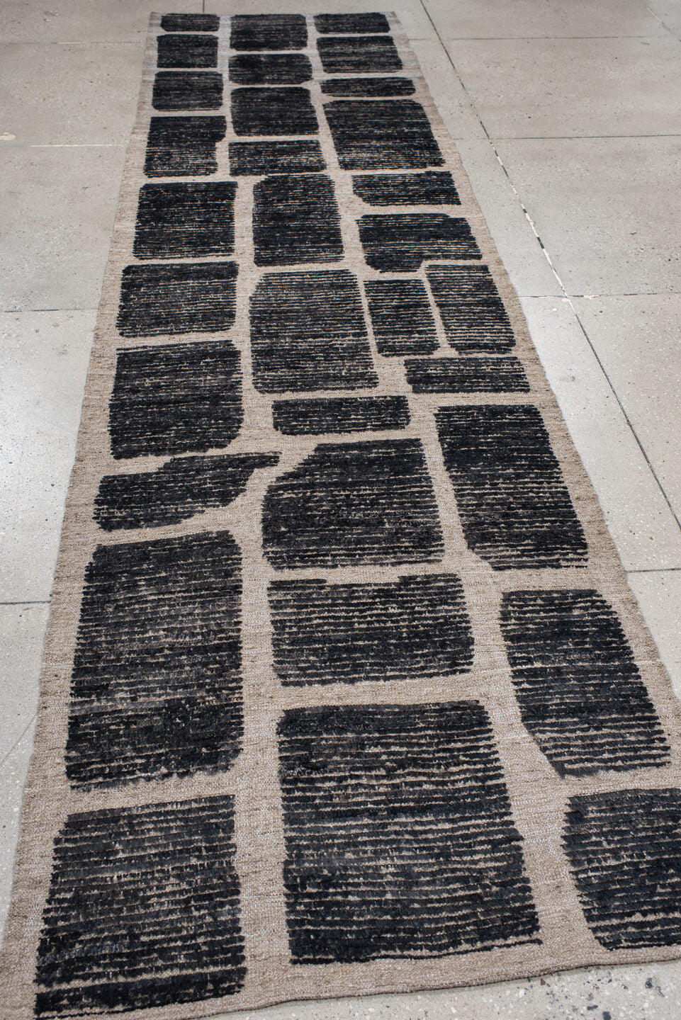 3' x 12' one-of-a-kind handmade vintage Tulu runner rug. Color palette: charcoal, taupe, ivory, gray, black, beige