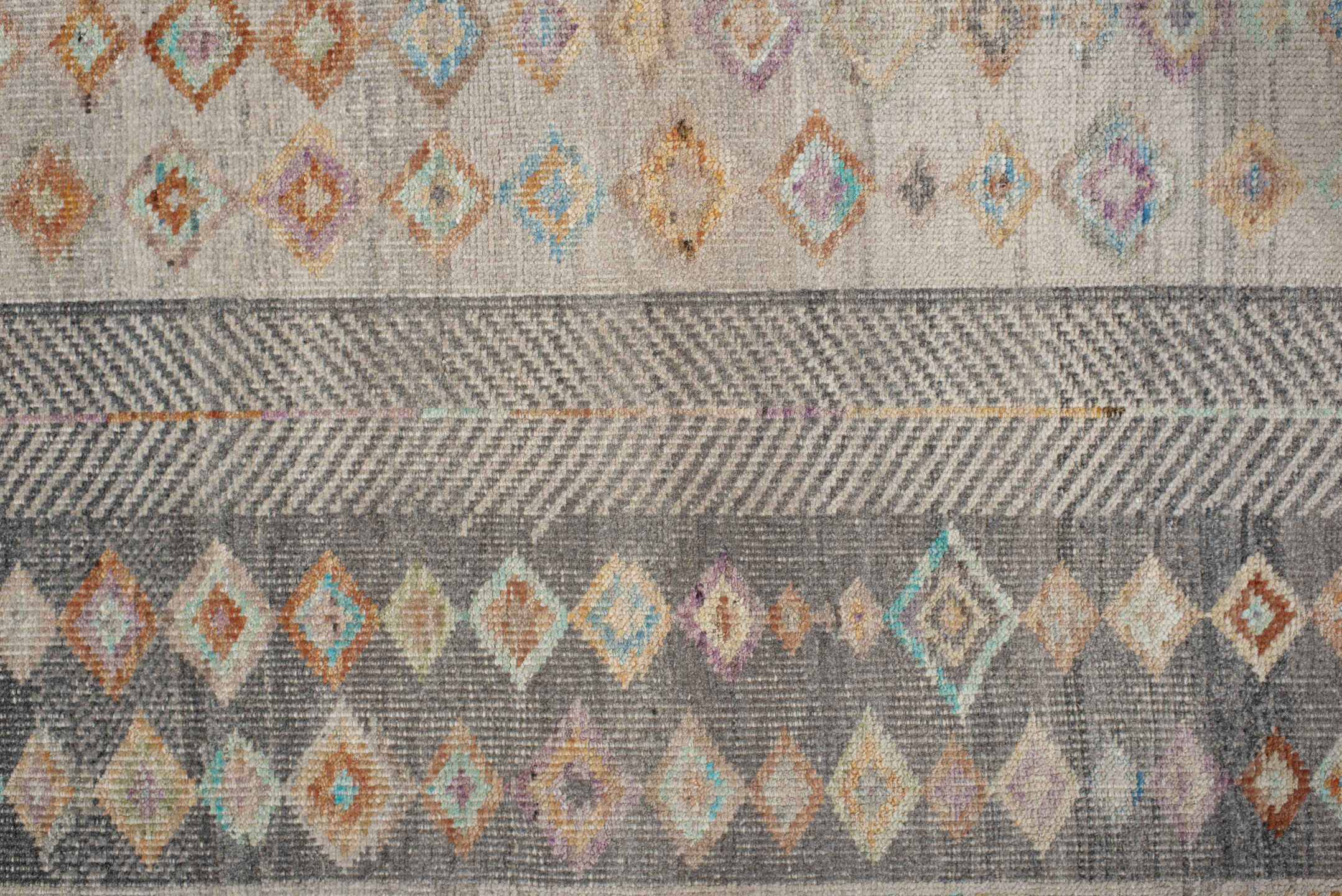3' x 12' one-of-a-kind handmade vintage Tulu runner rug. Color palette: brown, dim gray, gray, light gray, off-white, orange