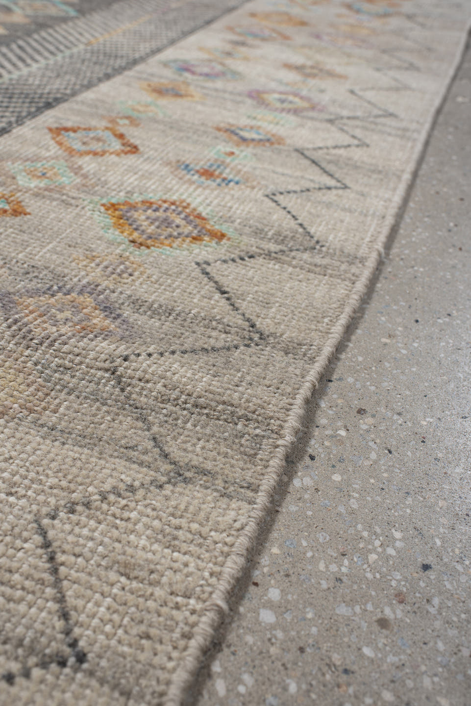 3' x 12' one-of-a-kind handmade vintage Tulu runner rug. Color palette: ivory, taupe, charcoal, camel, pale blue, saffron