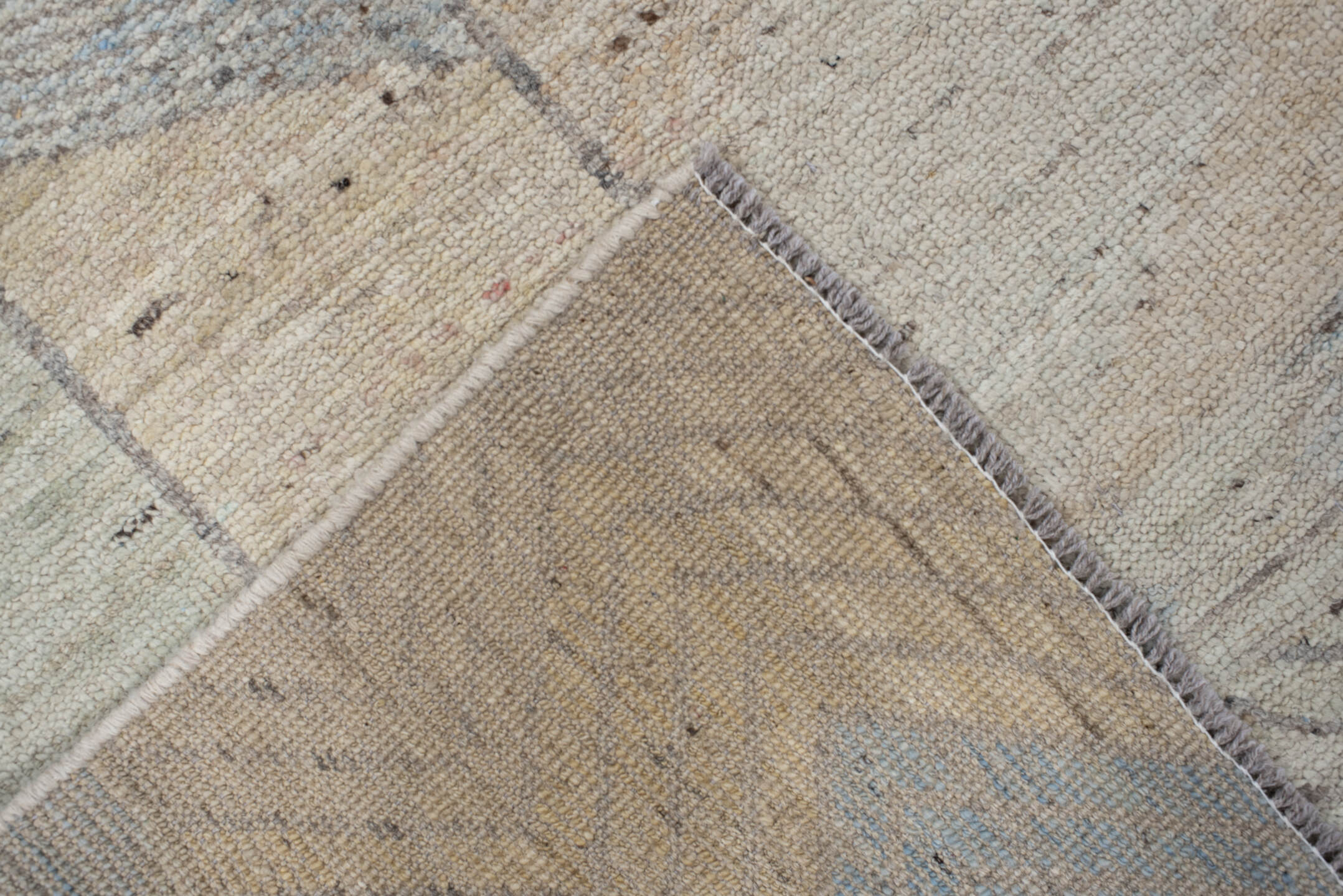 5' x 7' one-of-a-kind handmade vintage Tulu rug. Color palette: ivory, taupe, gray, pale blue, cream, charcoal, sand, beige