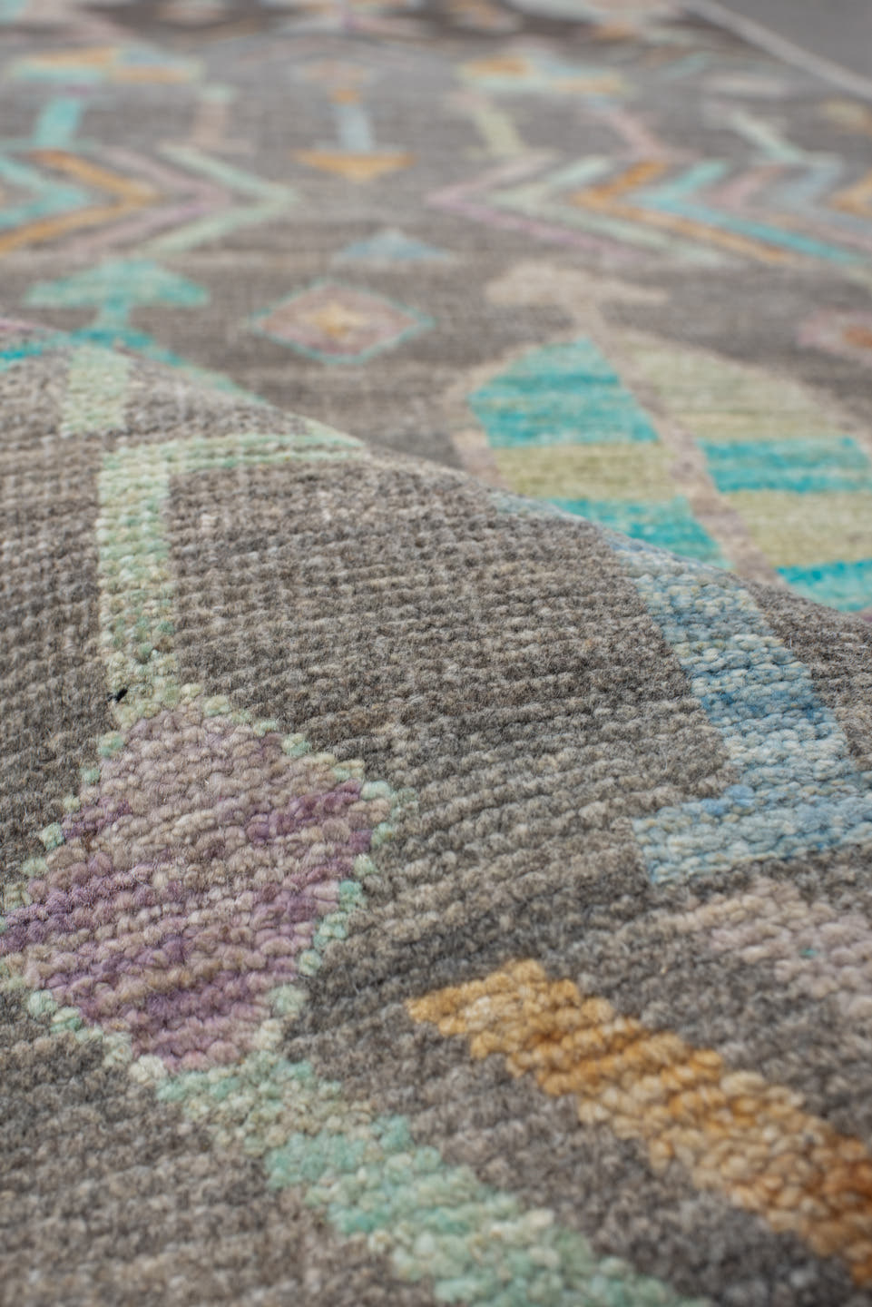 2' x 9' one-of-a-kind handmade vintage Tulu runner rug. Color palette: charcoal, aqua, ivory, lavender, peach, taupe, sage