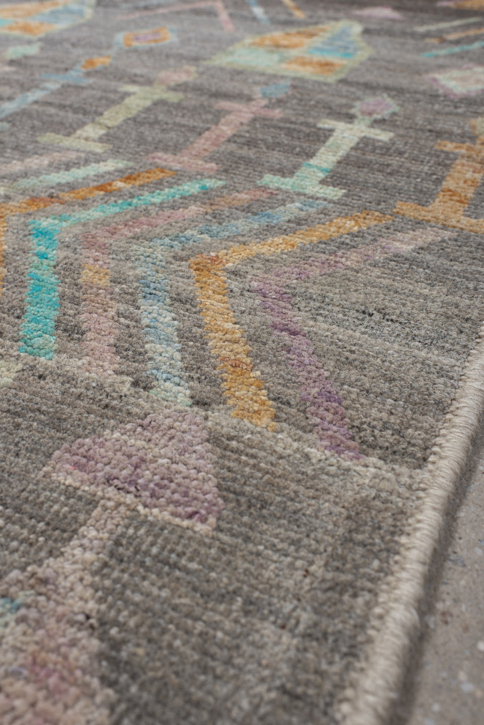 2' x 9' one-of-a-kind handmade vintage Tulu runner rug. Color palette: charcoal, aqua, ivory, lavender, peach, taupe, sage