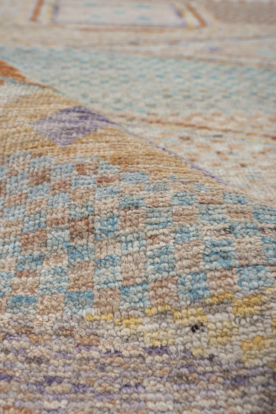 3' x 9' one-of-a-kind handmade vintage Tulu runner rug. Color palette: ivory, aqua, terra cotta, gold, lavender, taupe, teal