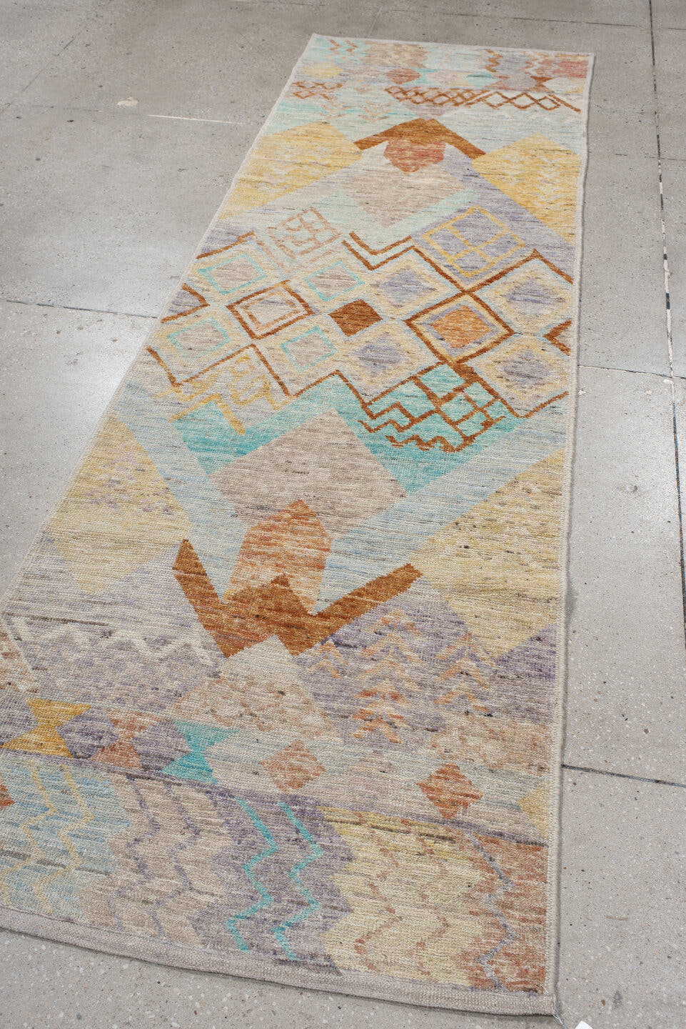 3' x 9' one-of-a-kind handmade vintage Tulu runner rug. Color palette: ivory, sky_blue, lavender, gold, rust, taupe, peach