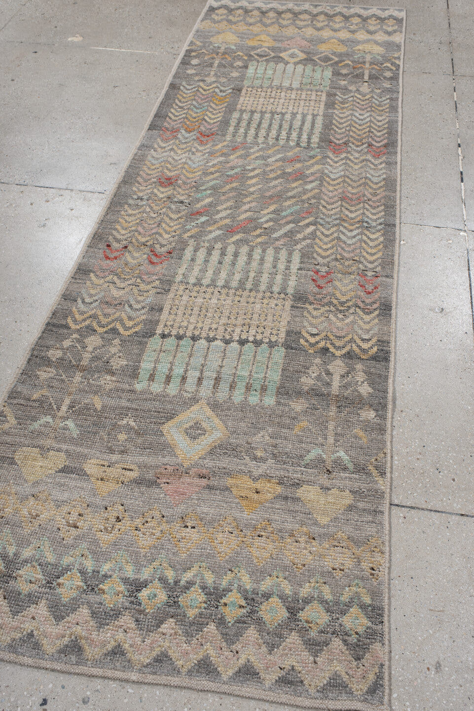 2' x 9' one-of-a-kind handmade vintage Tulu runner rug. Color palette: gray, ivory, taupe, pale aqua, butter yellow, blush