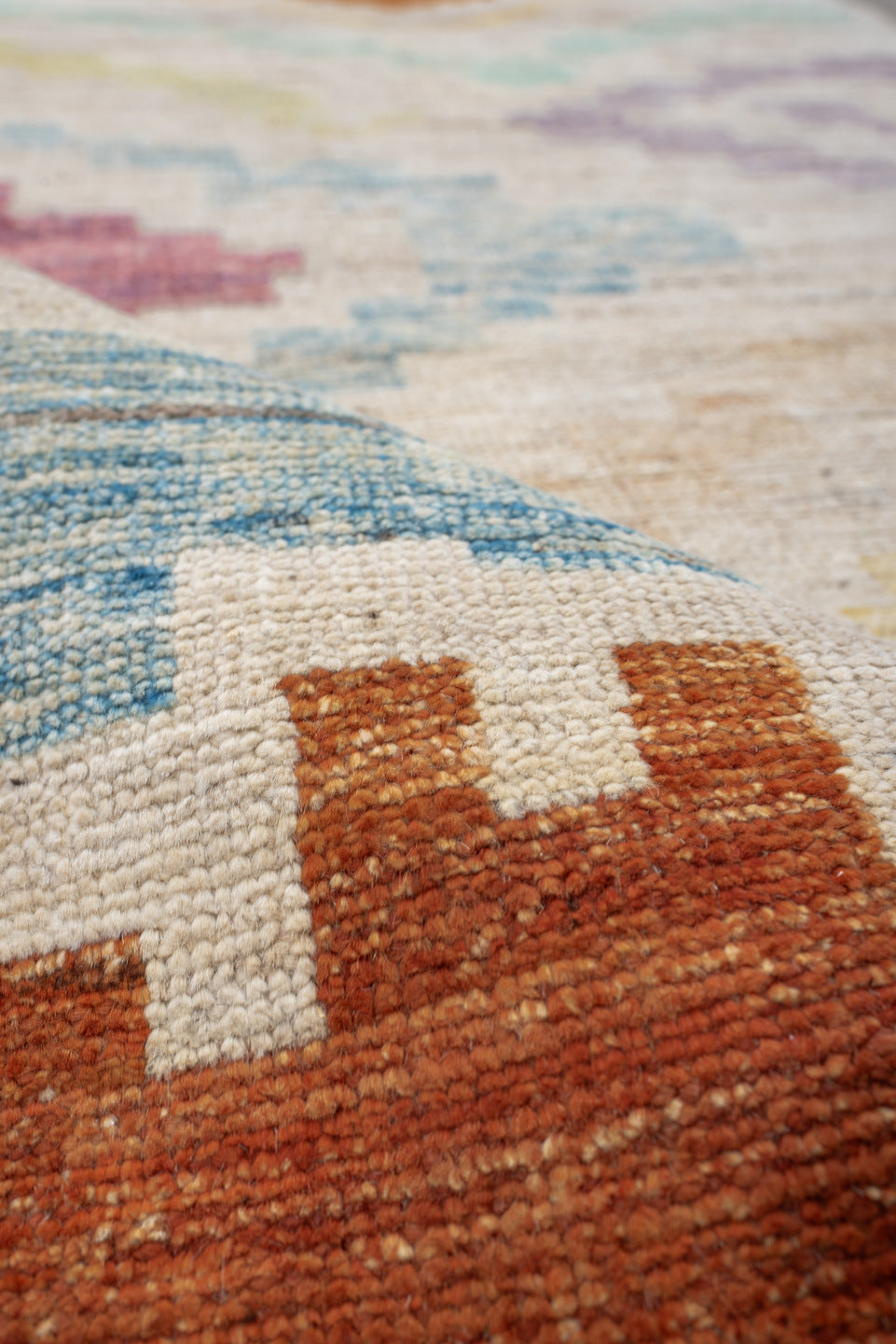 3' x 9' one-of-a-kind handmade vintage Tulu runner rug. Color palette: ivory, lavender, aqua, rust, gold, sage, rose, peach