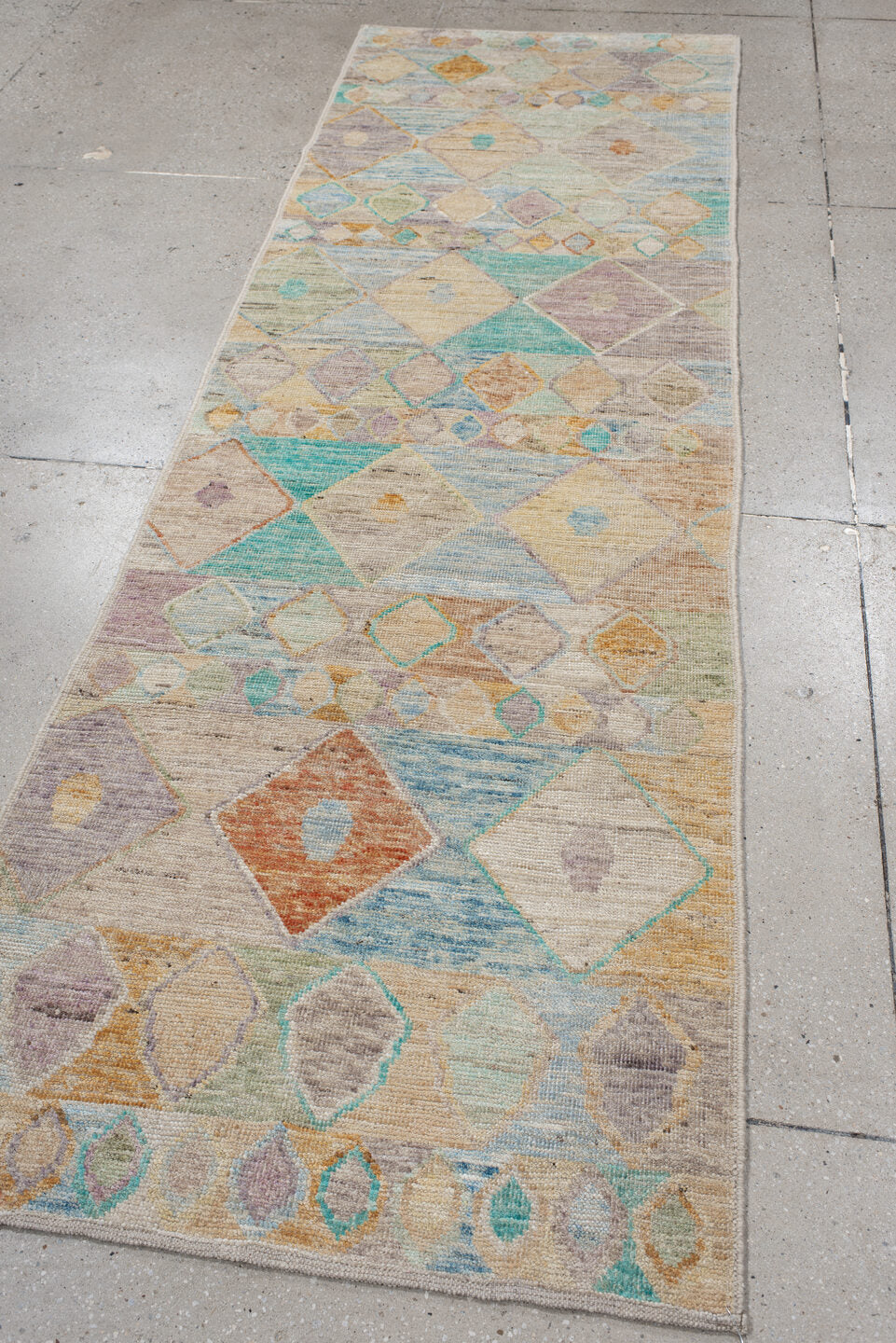 3' x 9' one-of-a-kind handmade vintage Tulu runner rug. Color palette: ivory, beige, aqua, sky_blue, taupe, lavender, peach
