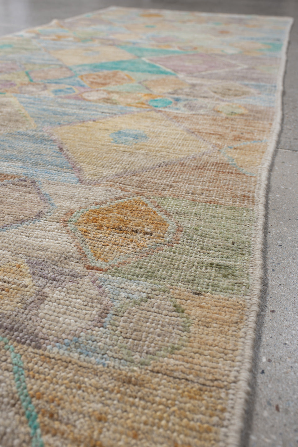 3' x 9' one-of-a-kind handmade vintage Tulu runner rug. Color palette: ivory, beige, aqua, sky_blue, taupe, lavender, peach