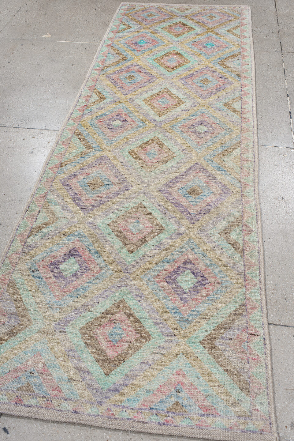 3' x 9' one-of-a-kind handmade vintage Tulu runner rug. Color palette: ivory, aqua, tan, blush, lavender, sage, gold, teal