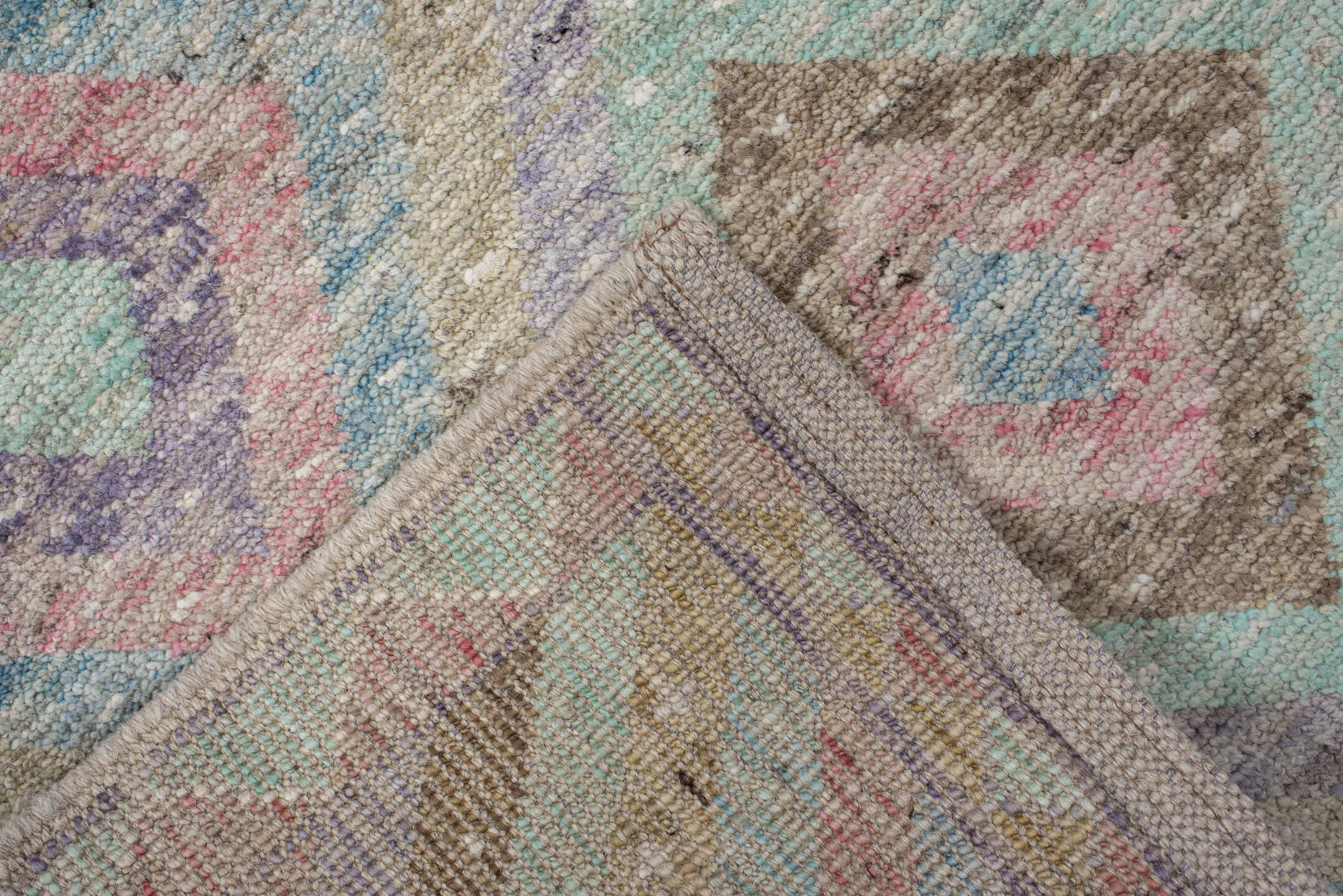 3' x 9' one-of-a-kind handmade vintage Tulu runner rug. Color palette: ivory, aqua, tan, blush, lavender, sage, gold, teal