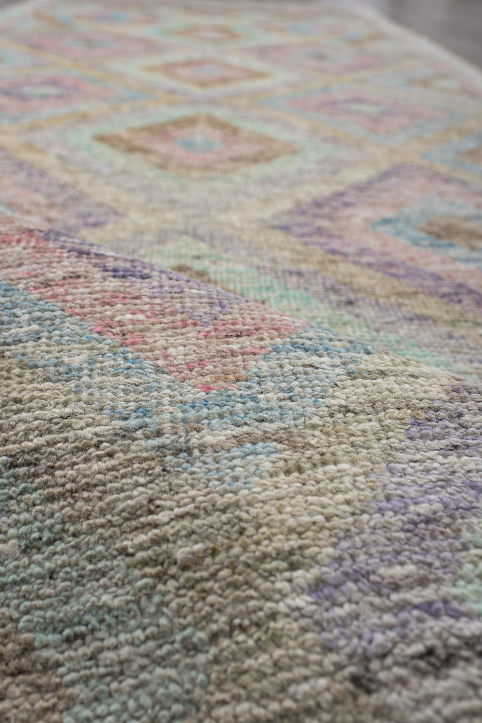 3' x 9' one-of-a-kind handmade vintage Tulu runner rug. Color palette: ivory, aqua, tan, blush, lavender, sage, gold, teal