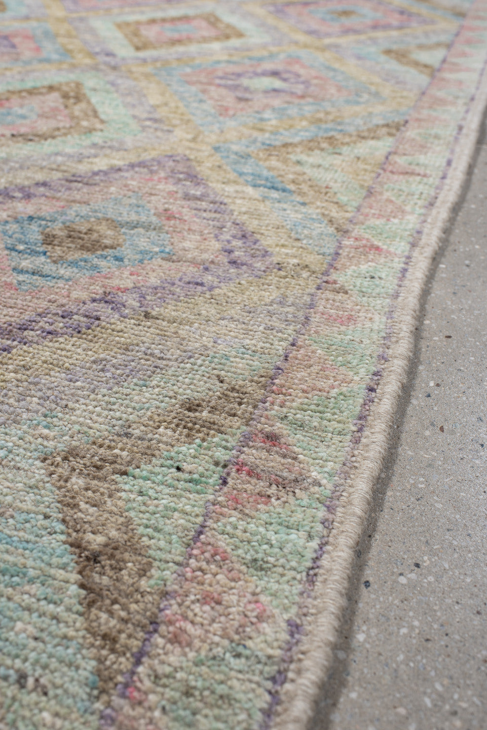 3' x 9' one-of-a-kind handmade vintage Tulu runner rug. Color palette: ivory, aqua, tan, blush, lavender, sage, gold, teal