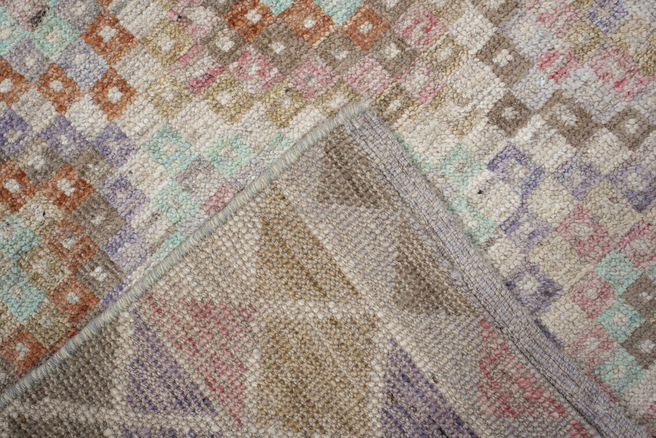 2' x 12' one-of-a-kind handmade vintage Tulu runner rug. Color palette: ivory, taupe, aqua, rust, lavender, rose, sage, sand