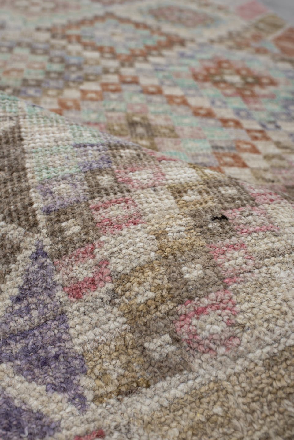 2' x 12' one-of-a-kind handmade vintage Tulu runner rug. Color palette: ivory, taupe, aqua, rust, lavender, rose, sage, sand
