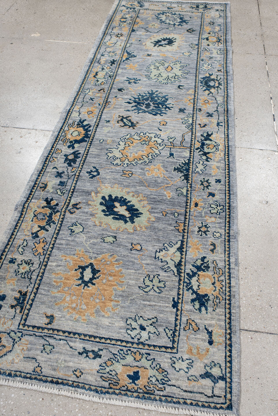 3' x 9' one-of-a-kind handmade vintage Oushak runner rug. Color palette: light blue, navy, ivory, gold, slate, cream, blue