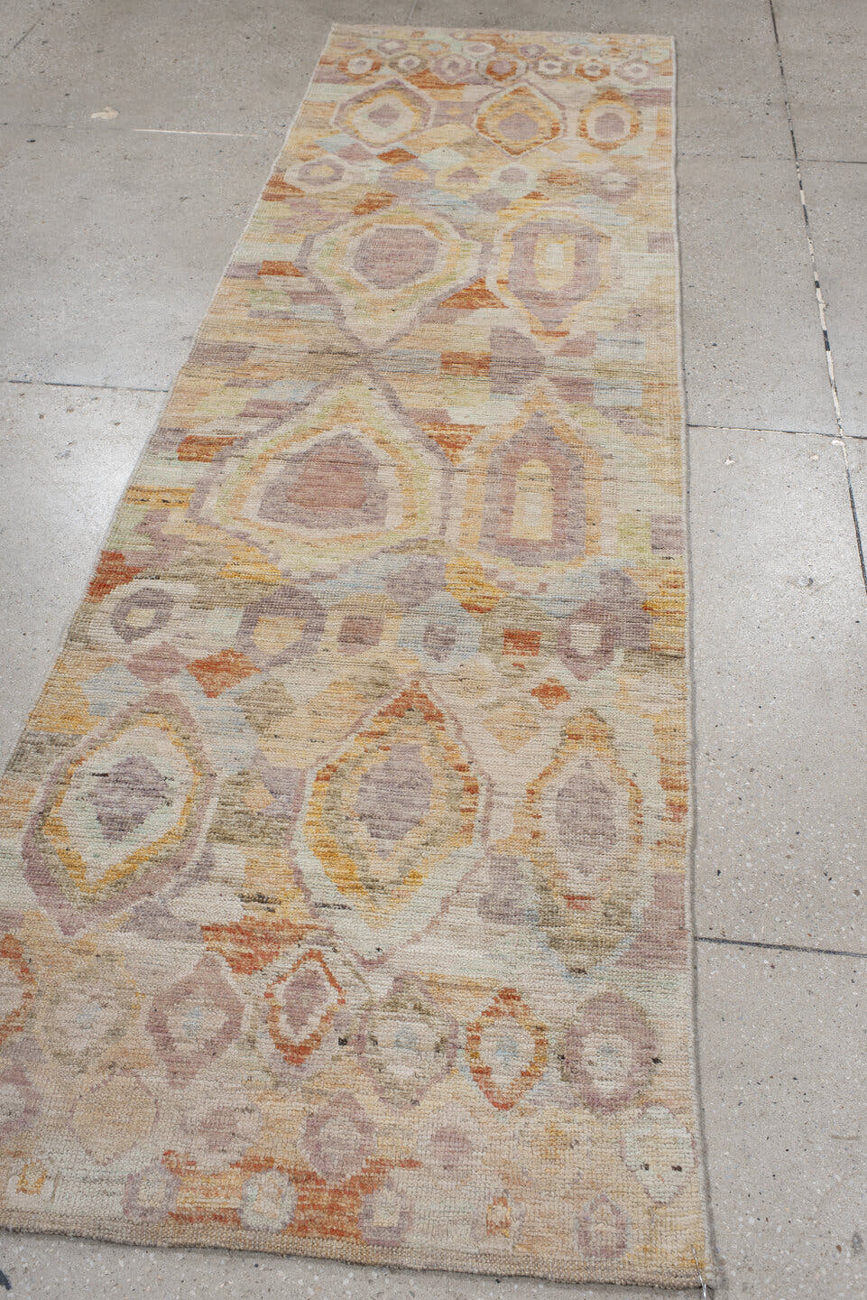 2' x 9' one-of-a-kind handmade vintage Kilim runner rug. Color palette: ivory, lavender, apricot, pale blue, beige, sage