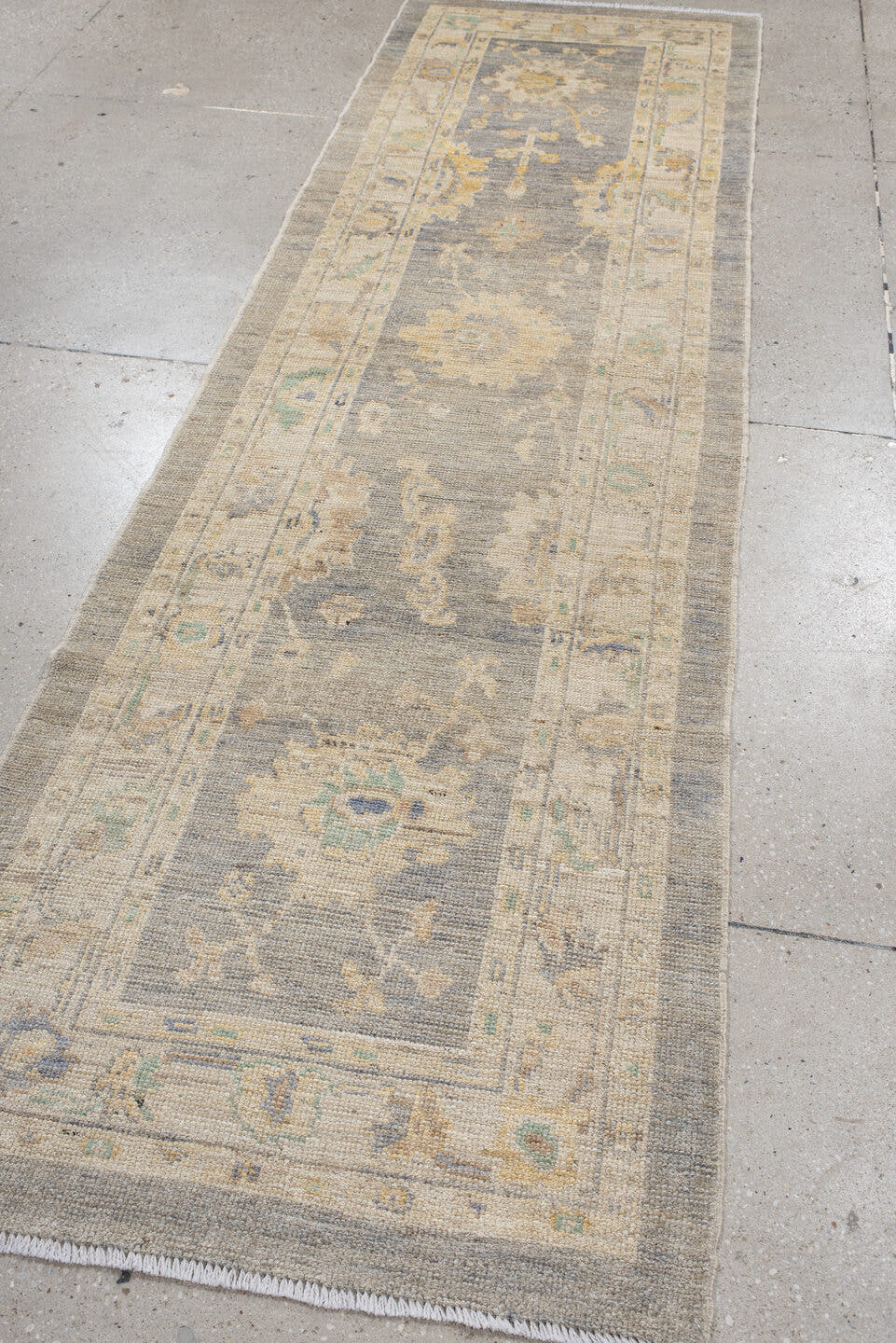 2' x 10' one-of-a-kind handmade vintage Oushak runner rug. Color palette: gray, ivory, cream, pale blue, sage, gold, taupe