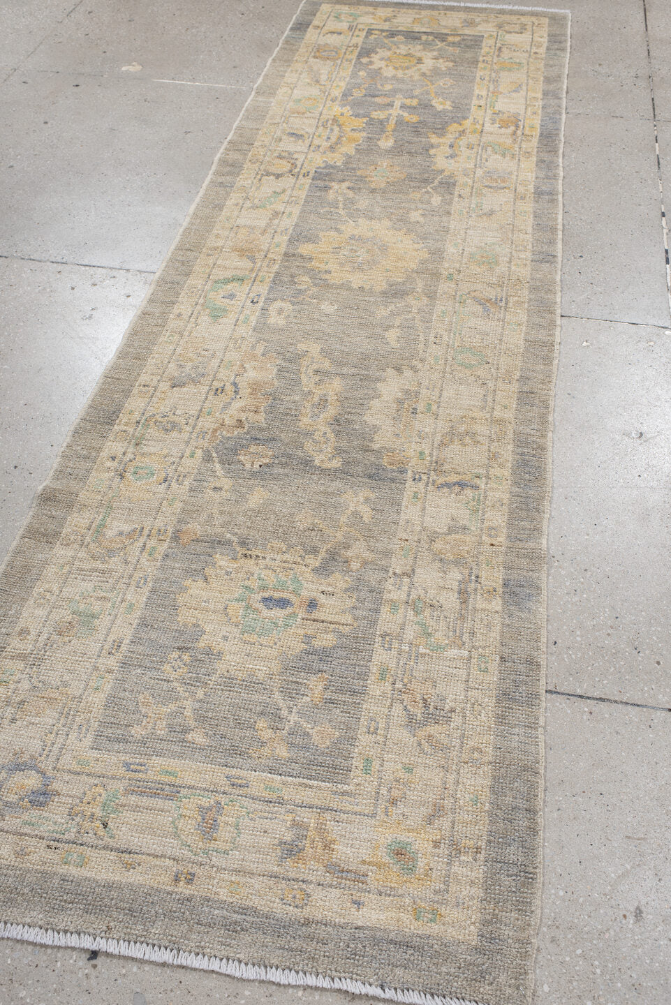 2' x 10' one-of-a-kind handmade vintage Oushak runner rug. Color palette: gray, ivory, cream, pale blue, sage, gold, taupe
