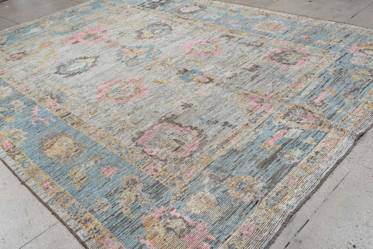 10' x 13' one-of-a-kind handmade vintage Oushak large size rug. Color palette: ivory, pale blue, blush, taupe, gold