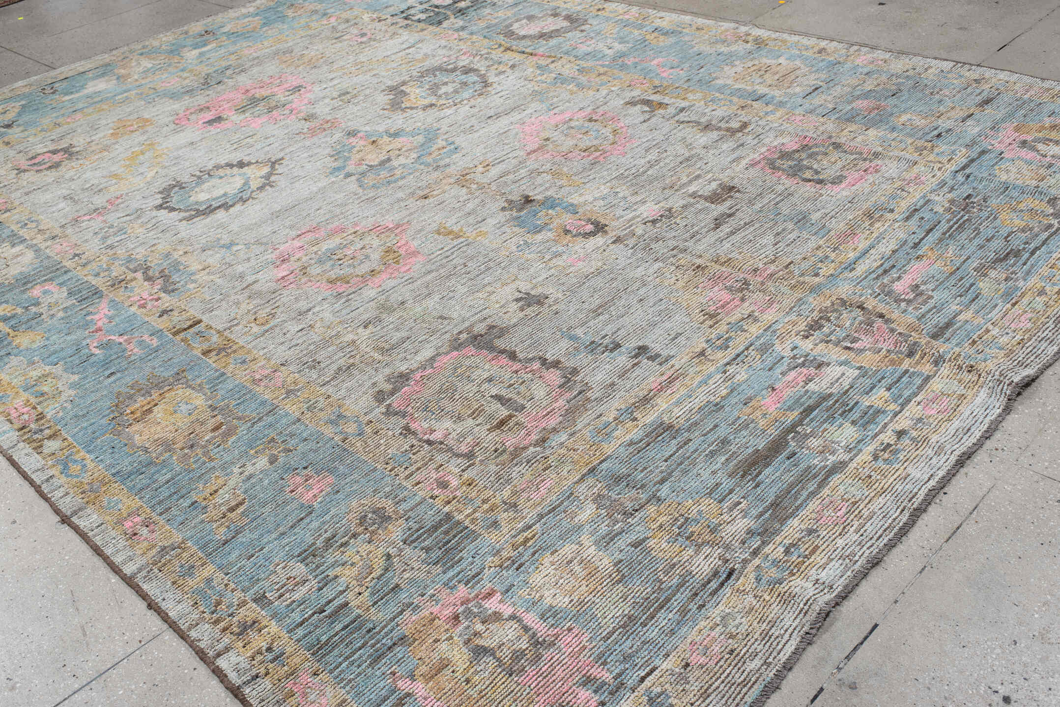 10' x 13' one-of-a-kind handmade vintage Oushak large size rug. Color palette: ivory, pale blue, blush, taupe, gold