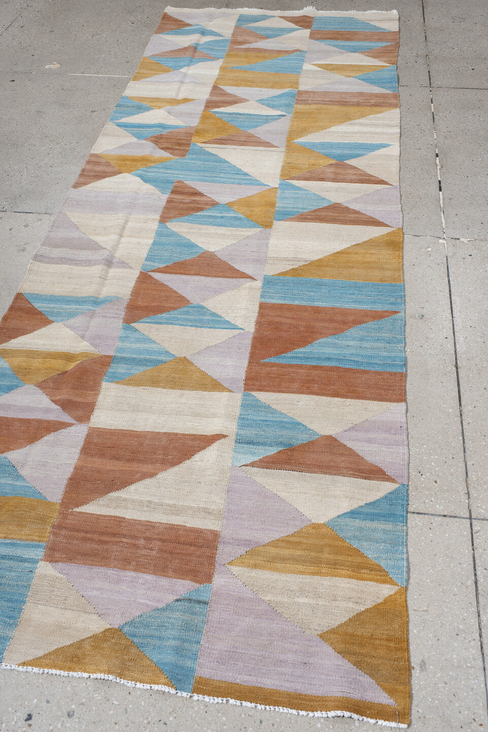 3' x 9' one-of-a-kind handmade vintage Kilim runner rug. Color palette: ivory, sky blue, camel, rose, lavender, tan