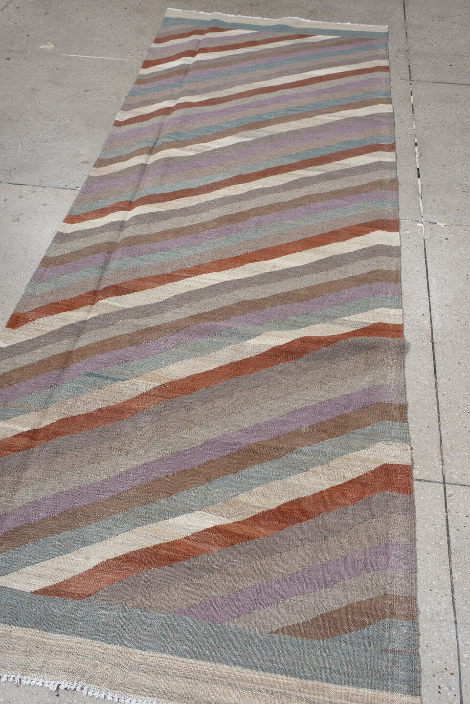 3' x 9' one-of-a-kind handmade vintage Kilim runner rug. Color palette: taupe, ivory, rust, lavender, pale_blue, camel