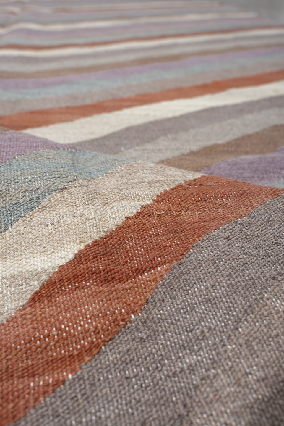 3' x 9' one-of-a-kind handmade vintage Kilim runner rug. Color palette: taupe, ivory, rust, lavender, pale_blue, camel