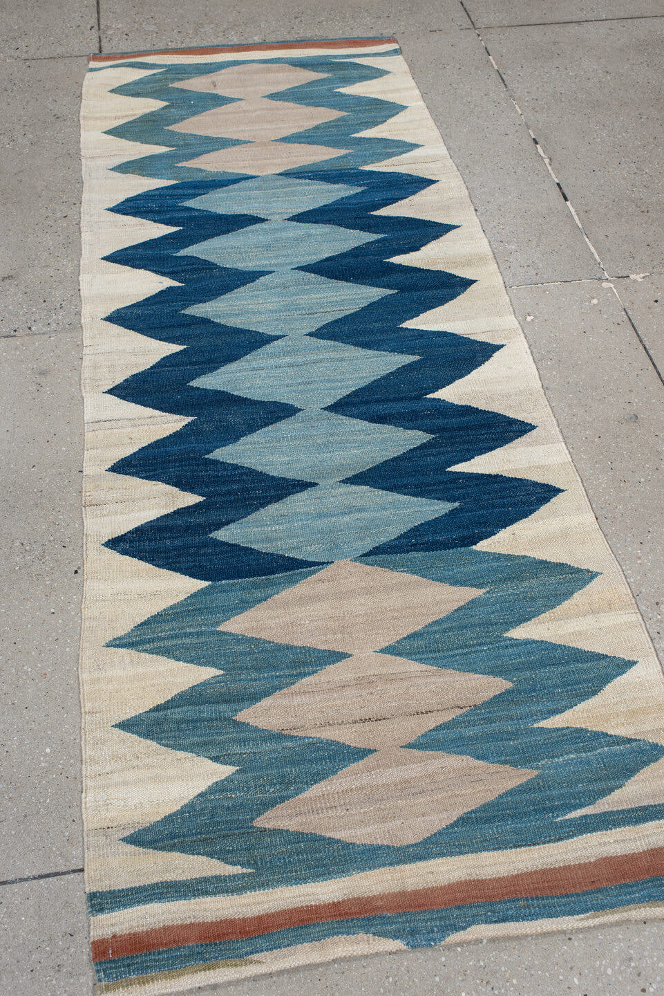 2' x 6' one-of-a-kind handmade vintage Kilim runner rug. Color palette: ivory, indigo, sky blue, teal, camel, rust, purple