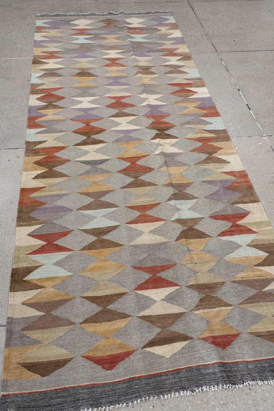 3' x 9' one-of-a-kind handmade vintage Kilim runner rug. Color palette: gray, taupe, ivory, brown, rust, lavender, camel
