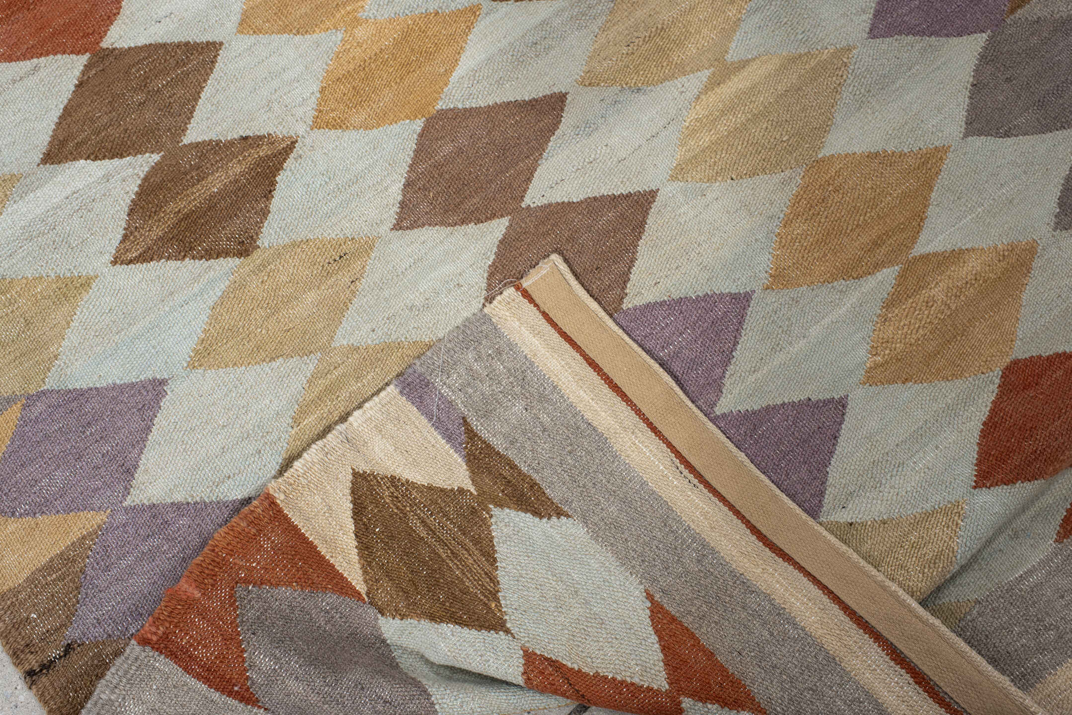 3' x 9' one-of-a-kind handmade vintage Kilim runner rug. Color palette: ivory, taupe, camel, lavender, rust, brown, sand
