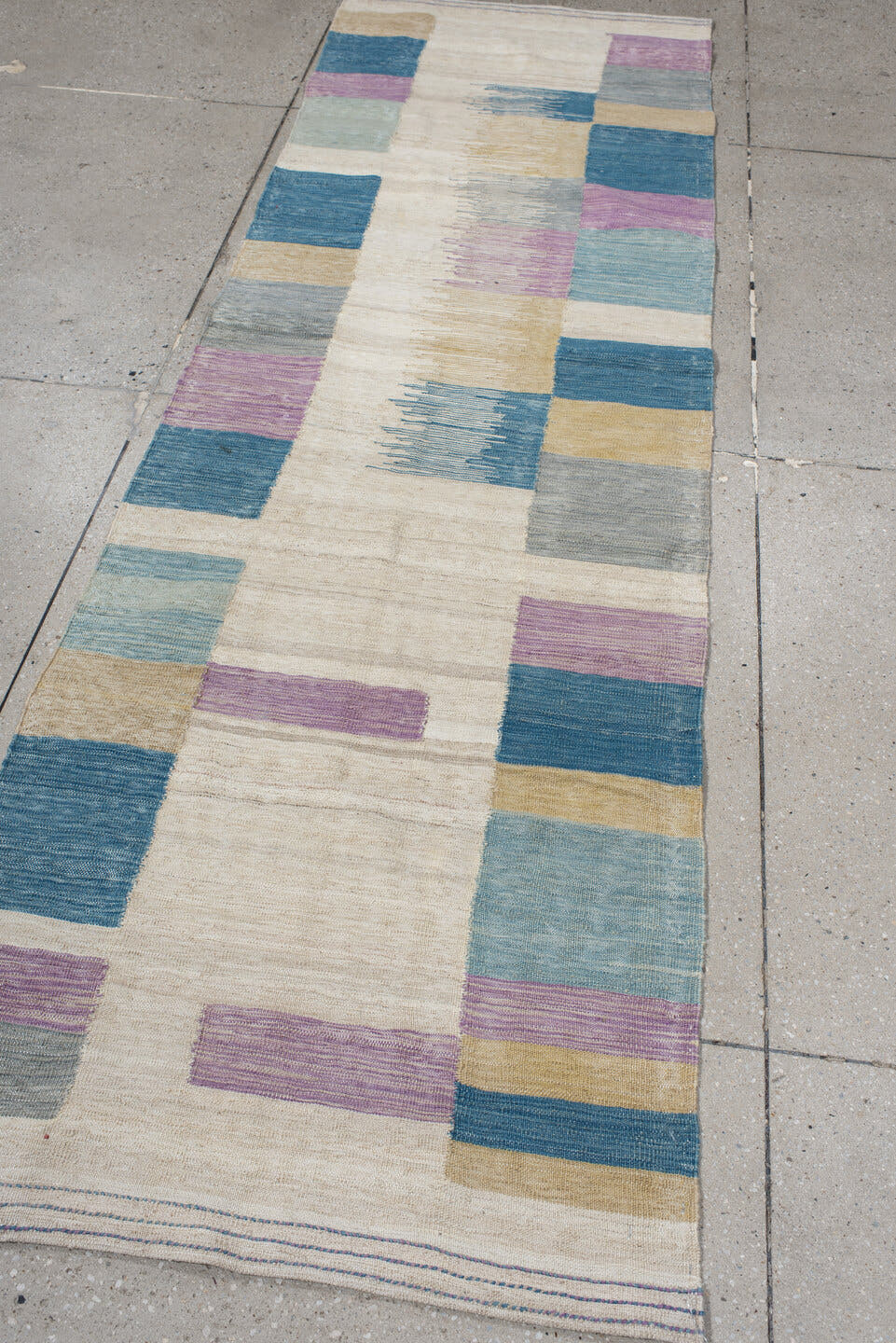 2' x 9' one-of-a-kind handmade vintage Kilim runner rug. Color palette: ivory, teal, lavender, light blue, gray, sand