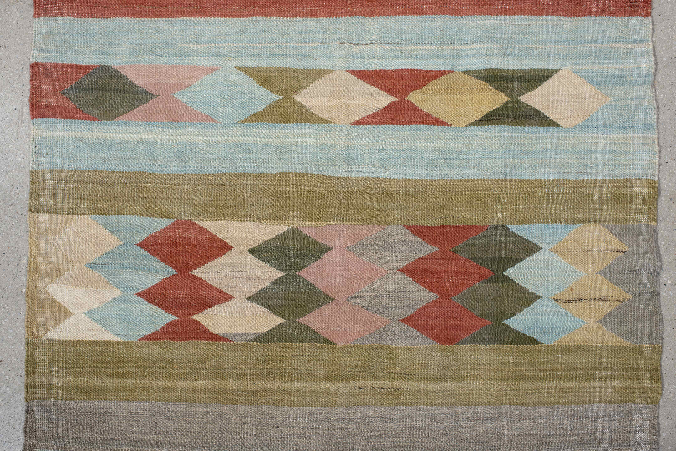 3' x 9' one-of-a-kind handmade vintage Kilim runner rug. Color palette: brown, gray, light gray, off-white, pink, red