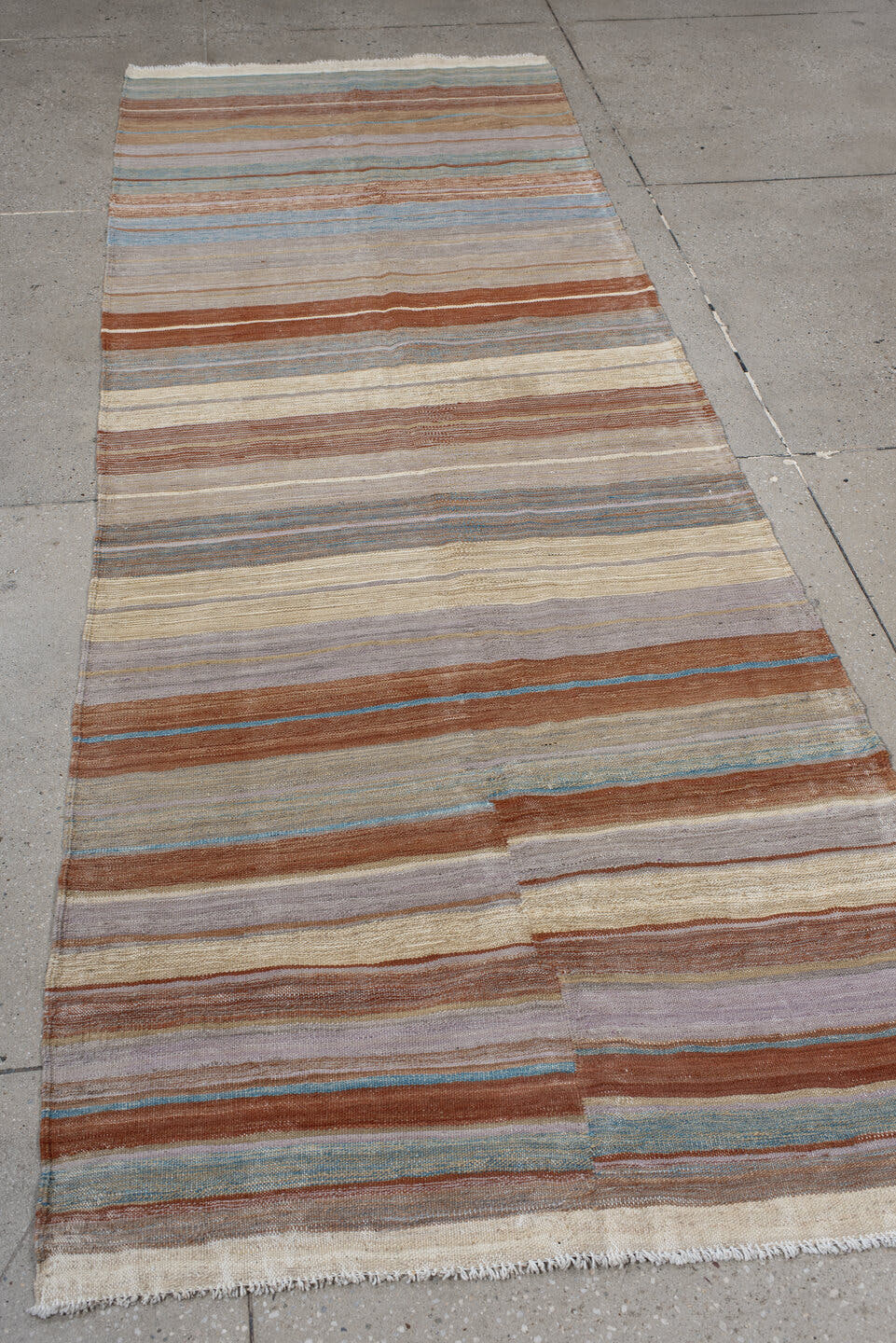 3' x 9' one-of-a-kind handmade vintage Kilim runner rug. Color palette: ivory, taupe, rust, pale blue, beige, camel