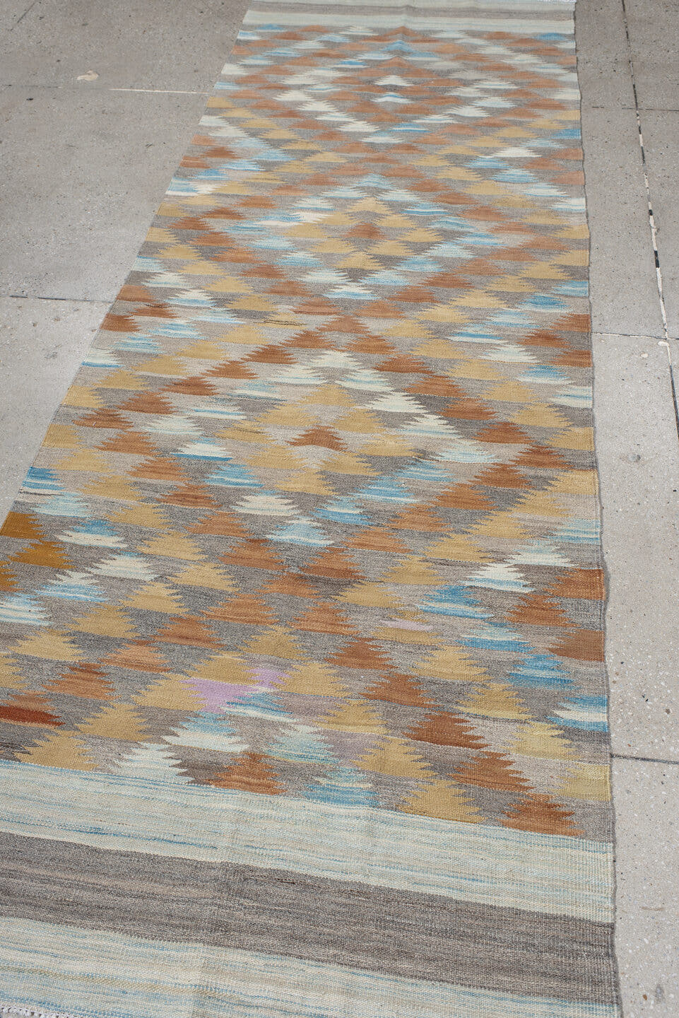 3' x 9' one-of-a-kind handmade vintage Kilim runner rug. Color palette: taupe, camel, ivory, rust, pale_blue, gray, beige