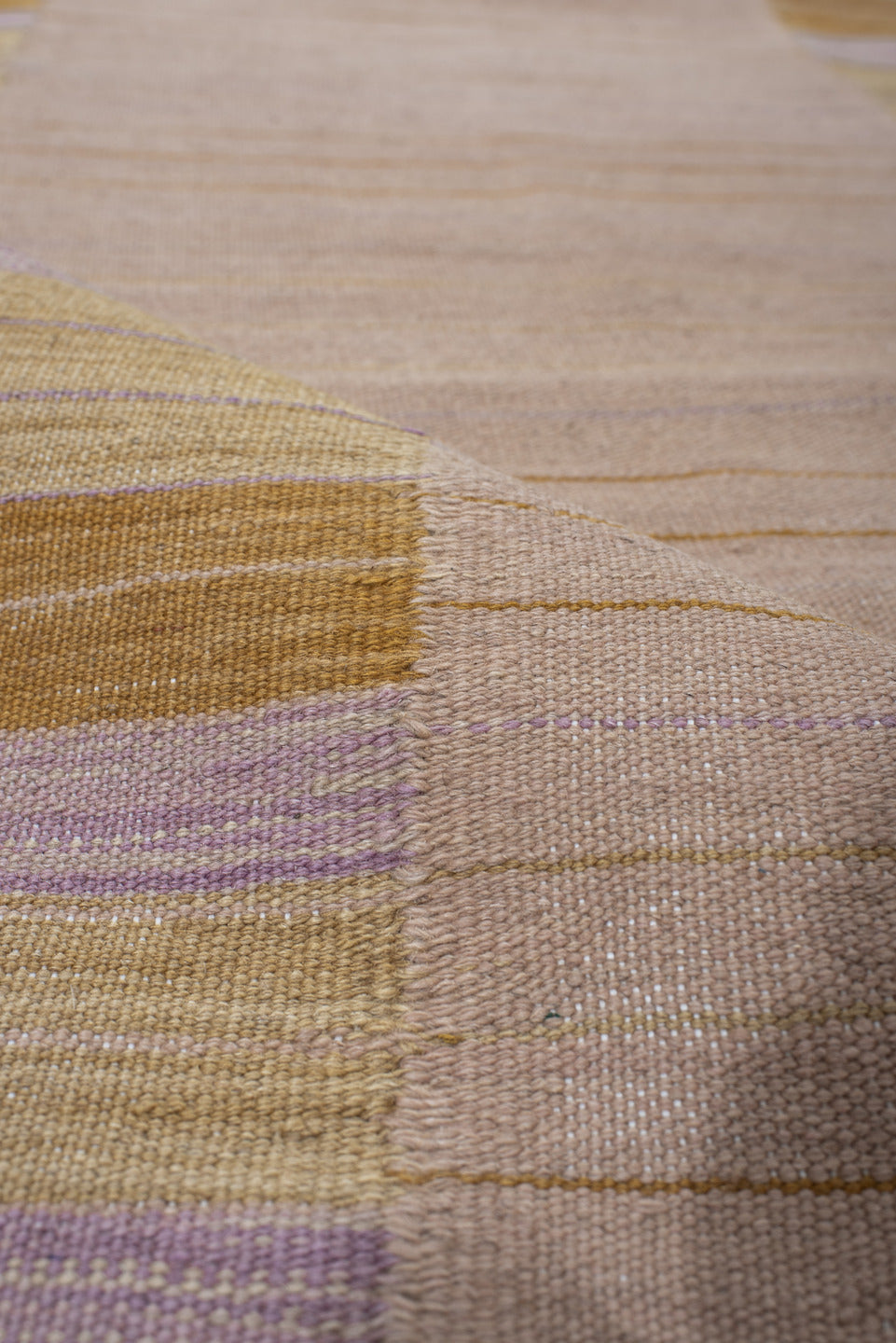 2' x 10' one-of-a-kind handmade vintage Kilim runner rug. Color palette: blush, gold, ivory, lavender, beige, pink