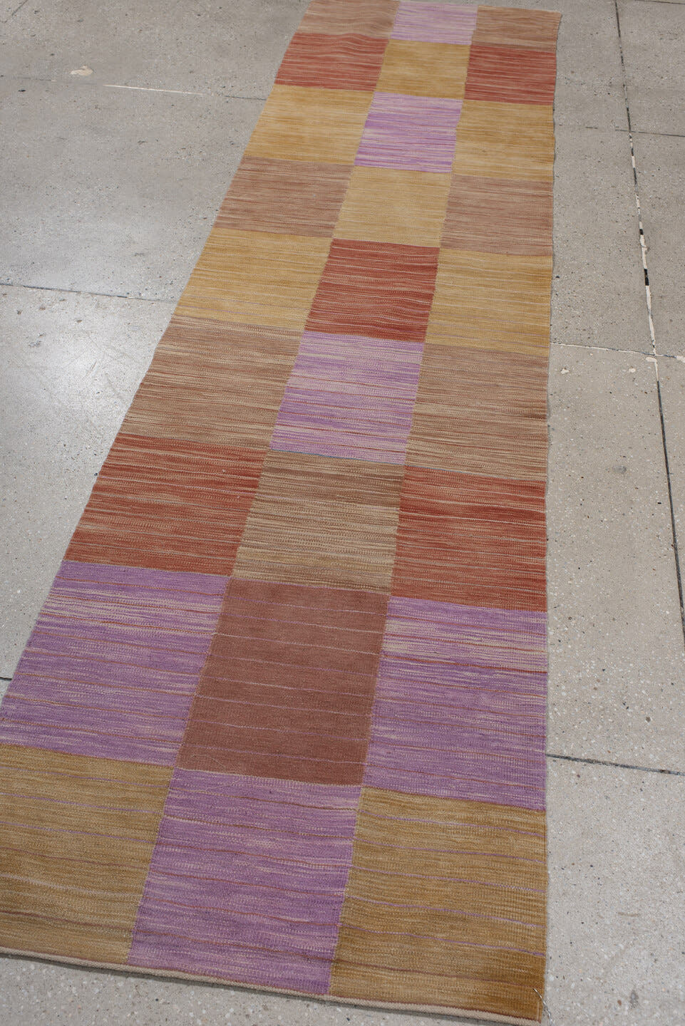 2' x 10' one-of-a-kind handmade vintage Kilim runner rug. Color palette: camel, rose, rust, lavender, tan, beige, pink, red