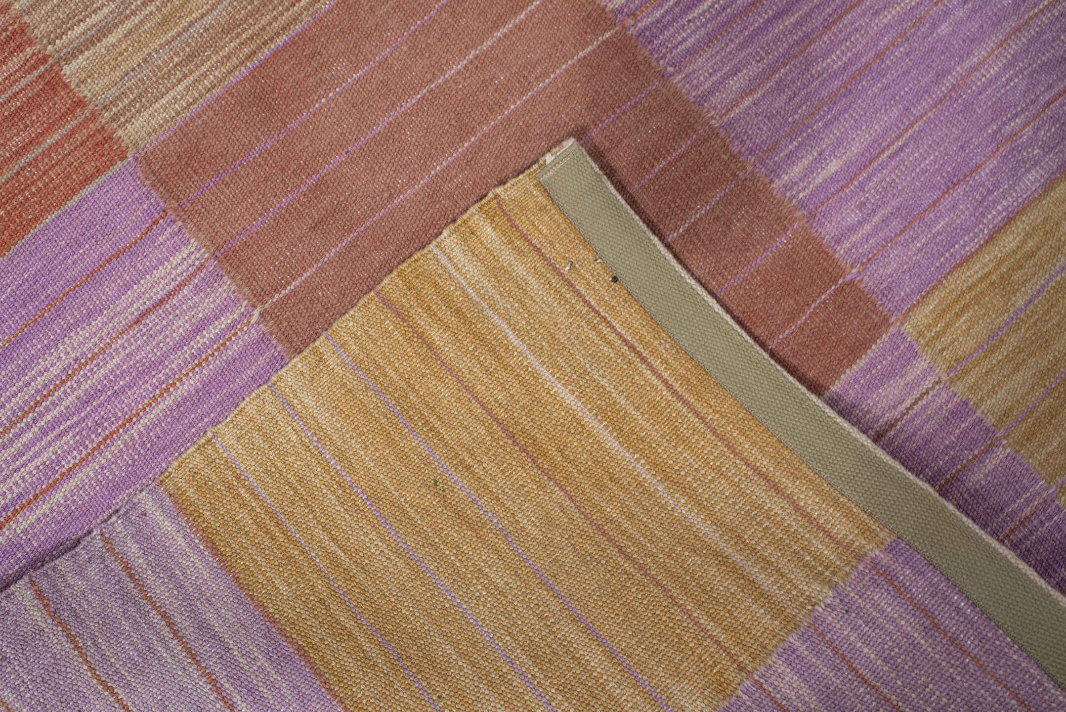 2' x 10' one-of-a-kind handmade vintage Kilim runner rug. Color palette: camel, rose, rust, lavender, tan, beige, pink, red