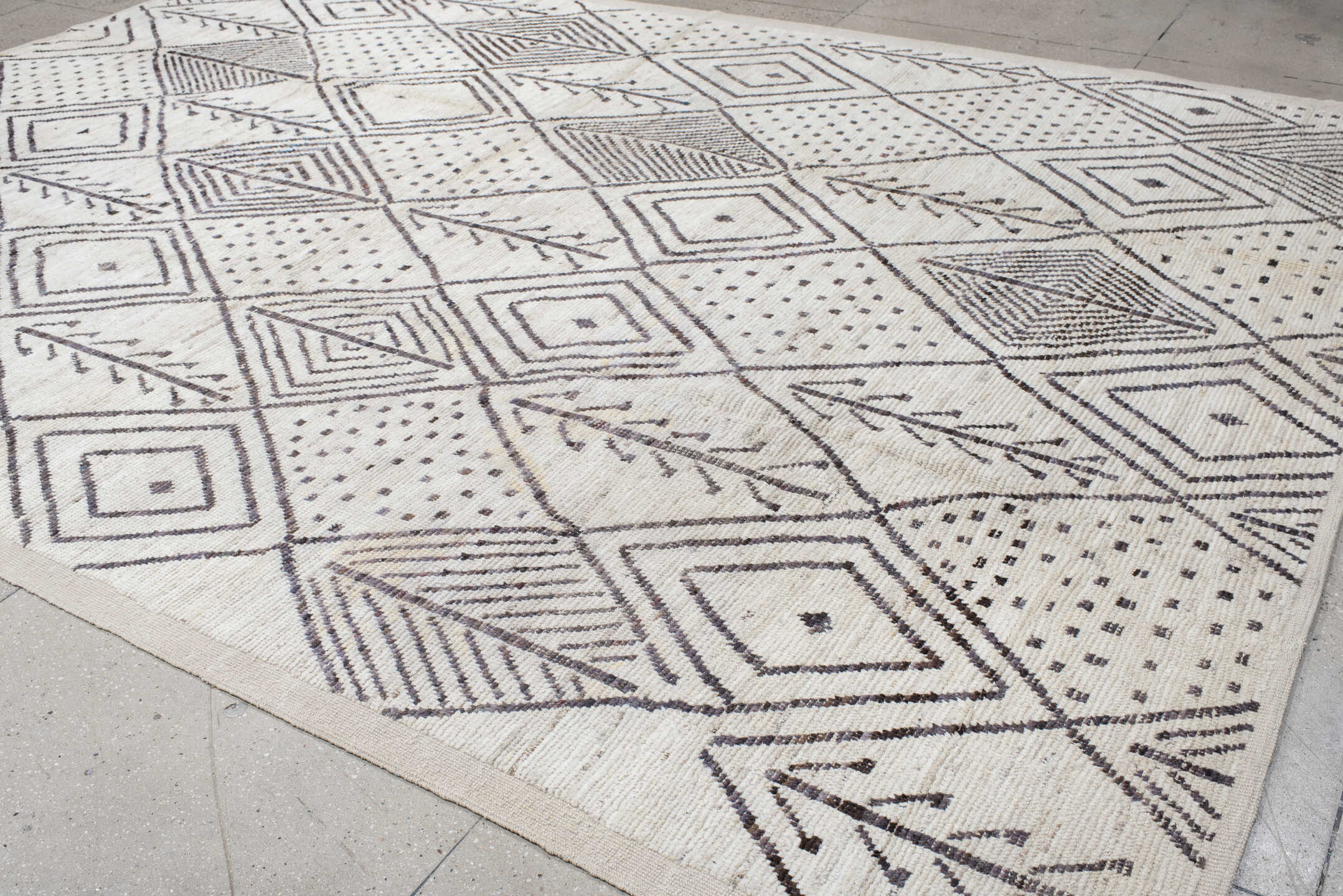 10' x 14' one-of-a-kind handmade vintage Tulu large size rug. Color palette: ivory, charcoal, taupe, brown, gray, black