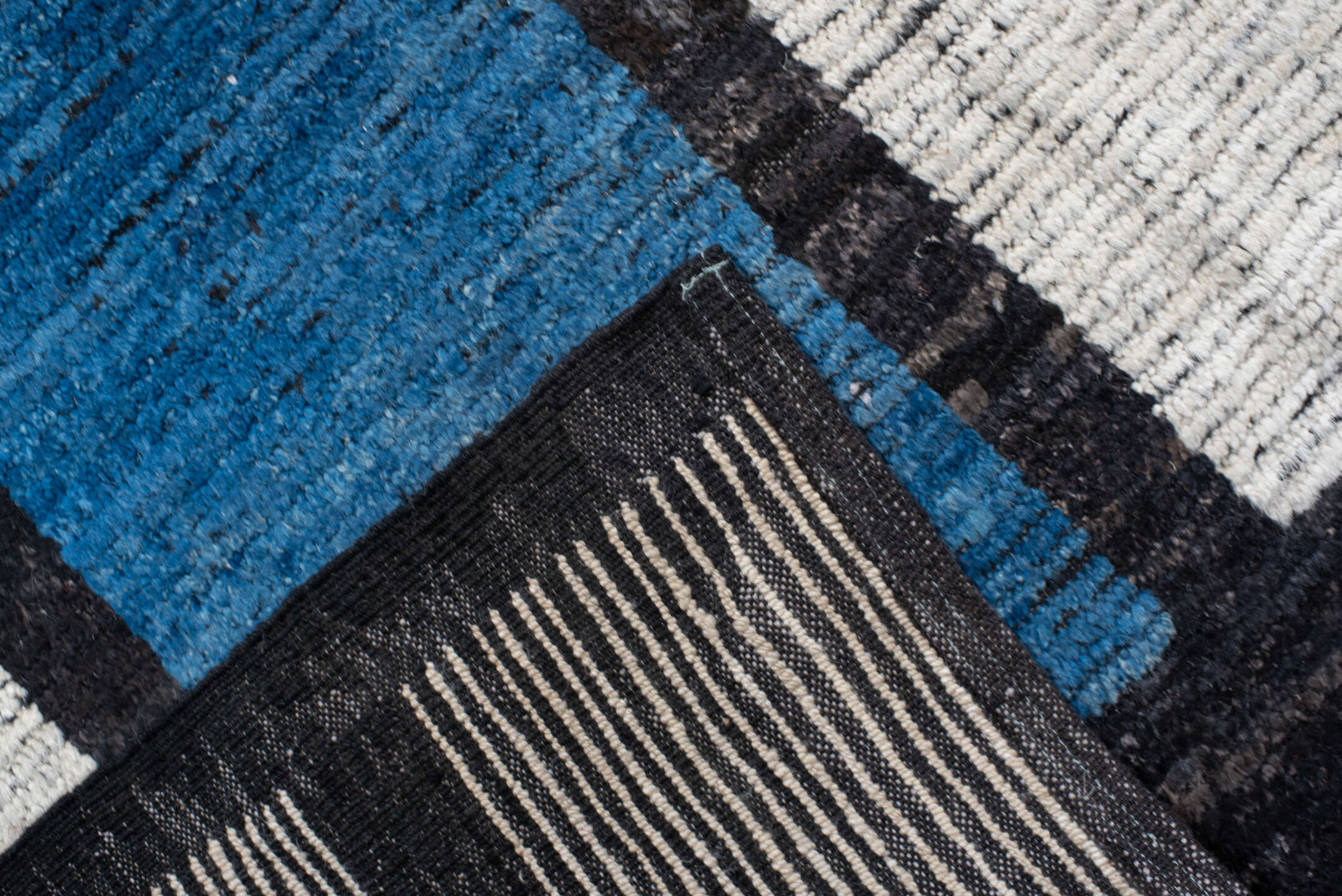 10' x 14' one-of-a-kind handmade vintage Tulu large size rug. Color palette: ivory, black, blue, red, yellow, gold