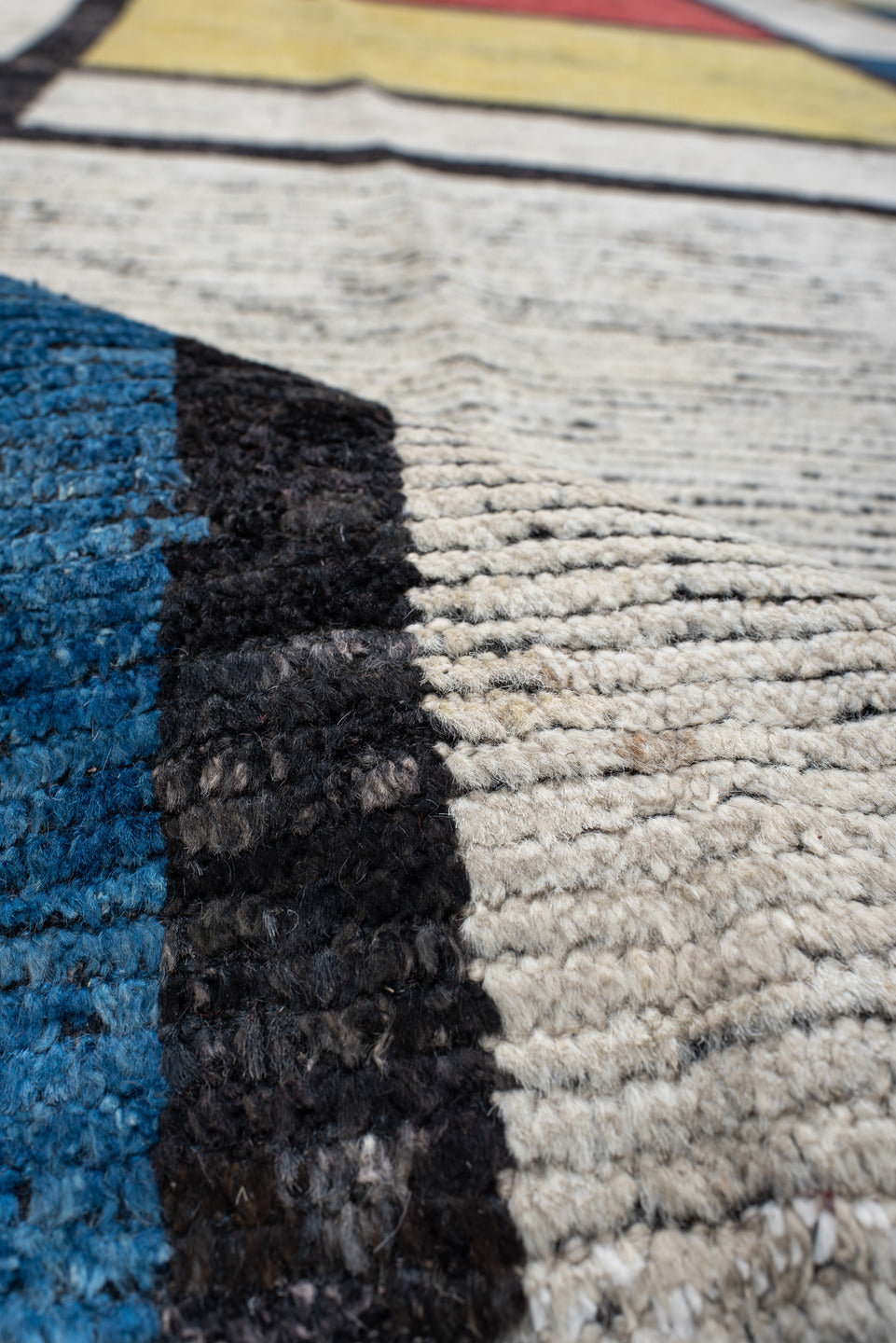 10' x 14' one-of-a-kind handmade vintage Tulu large size rug. Color palette: ivory, black, blue, red, yellow, gold