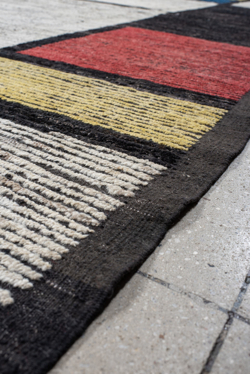 10' x 14' one-of-a-kind handmade vintage Tulu large size rug. Color palette: ivory, black, blue, red, yellow, gold